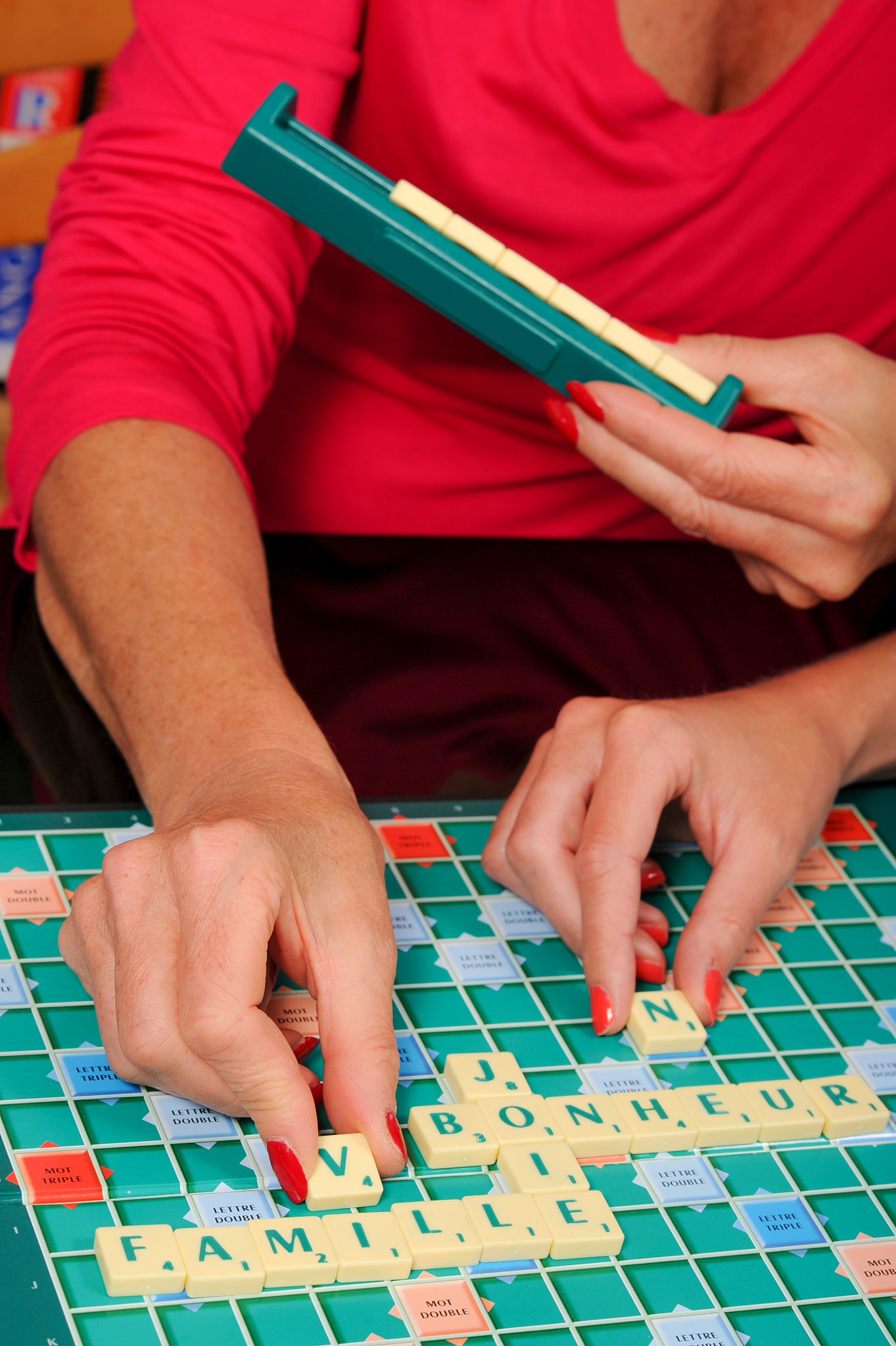 Nikon D3S + Nikon AF-S Nikkor 85mm F1.4G sample photo. Happy senior woman playing scrable with daugther photography