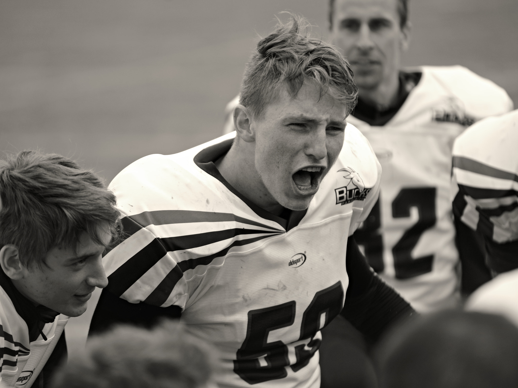 Sigma 70-200mm F2.8 EX DG Macro HSM II sample photo. Football huddle photography