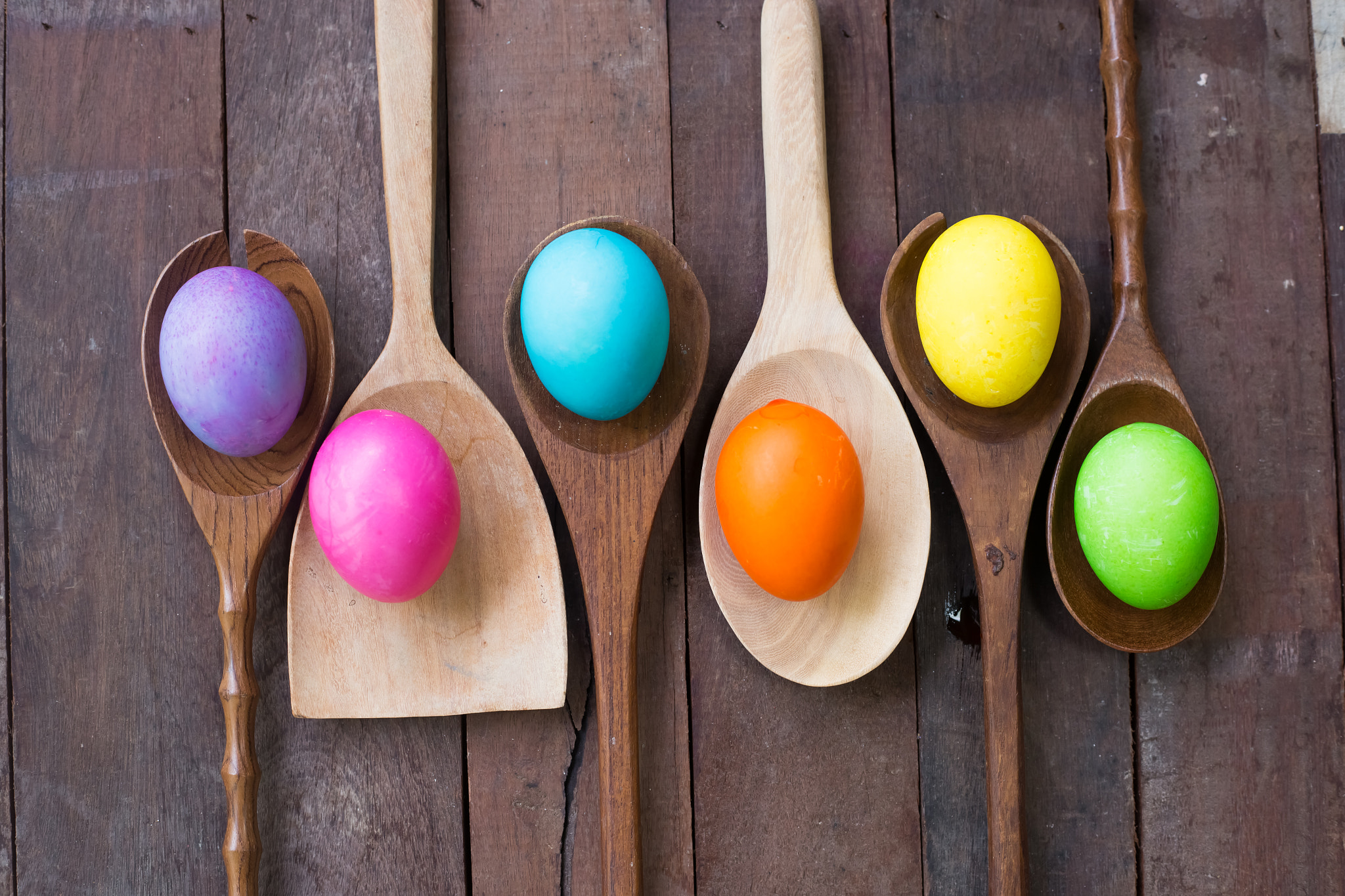 Easter eggs on a Wooden kitchenwareand wood background