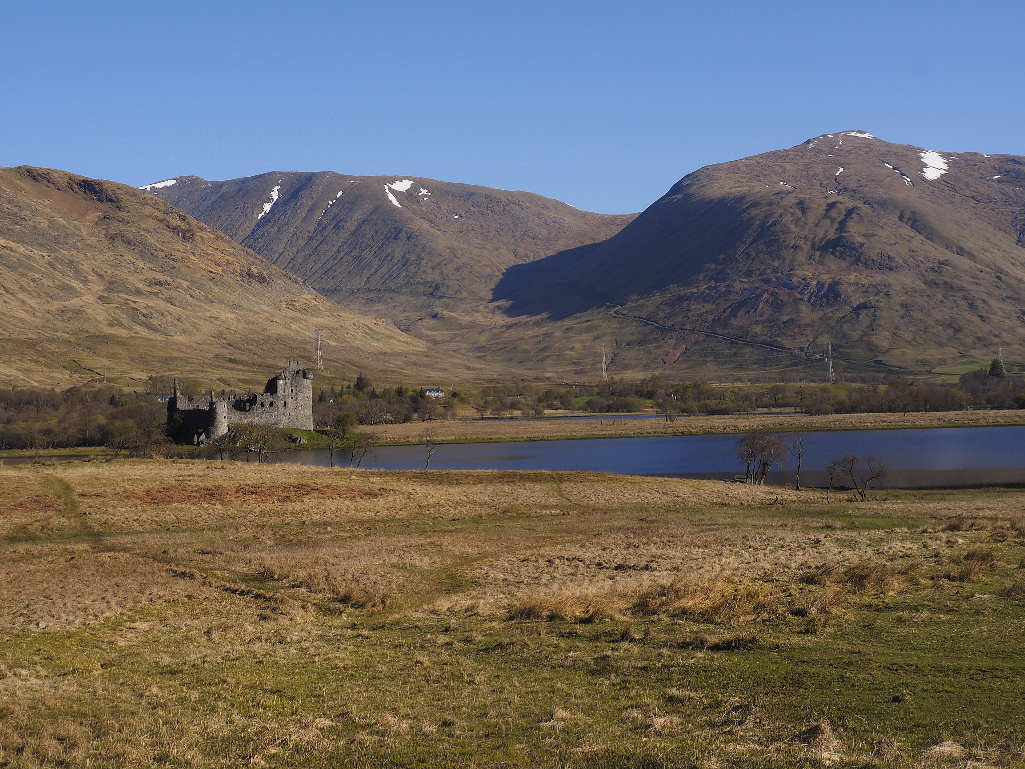Olympus OM-D E-M1 sample photo. Kilchurn castle at the end of loch awe, surrounded by mountains photography