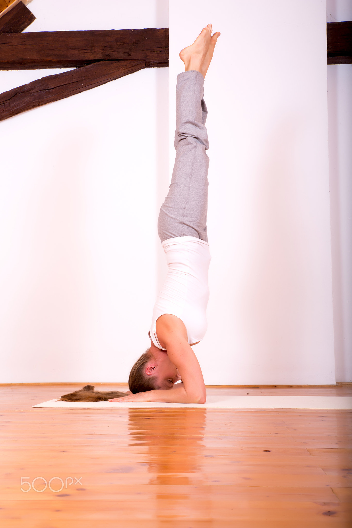 Woman practicing Yoga in a Studio