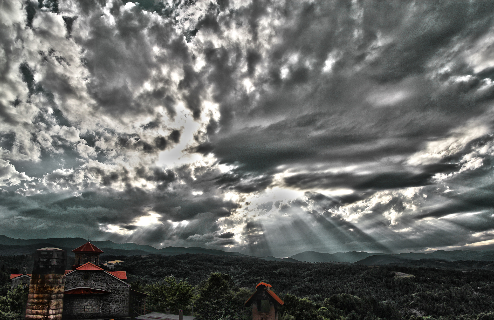 Canon EOS 60D + Sigma 18-50mm f/2.8 Macro sample photo. Prionia village on heavy weather photography