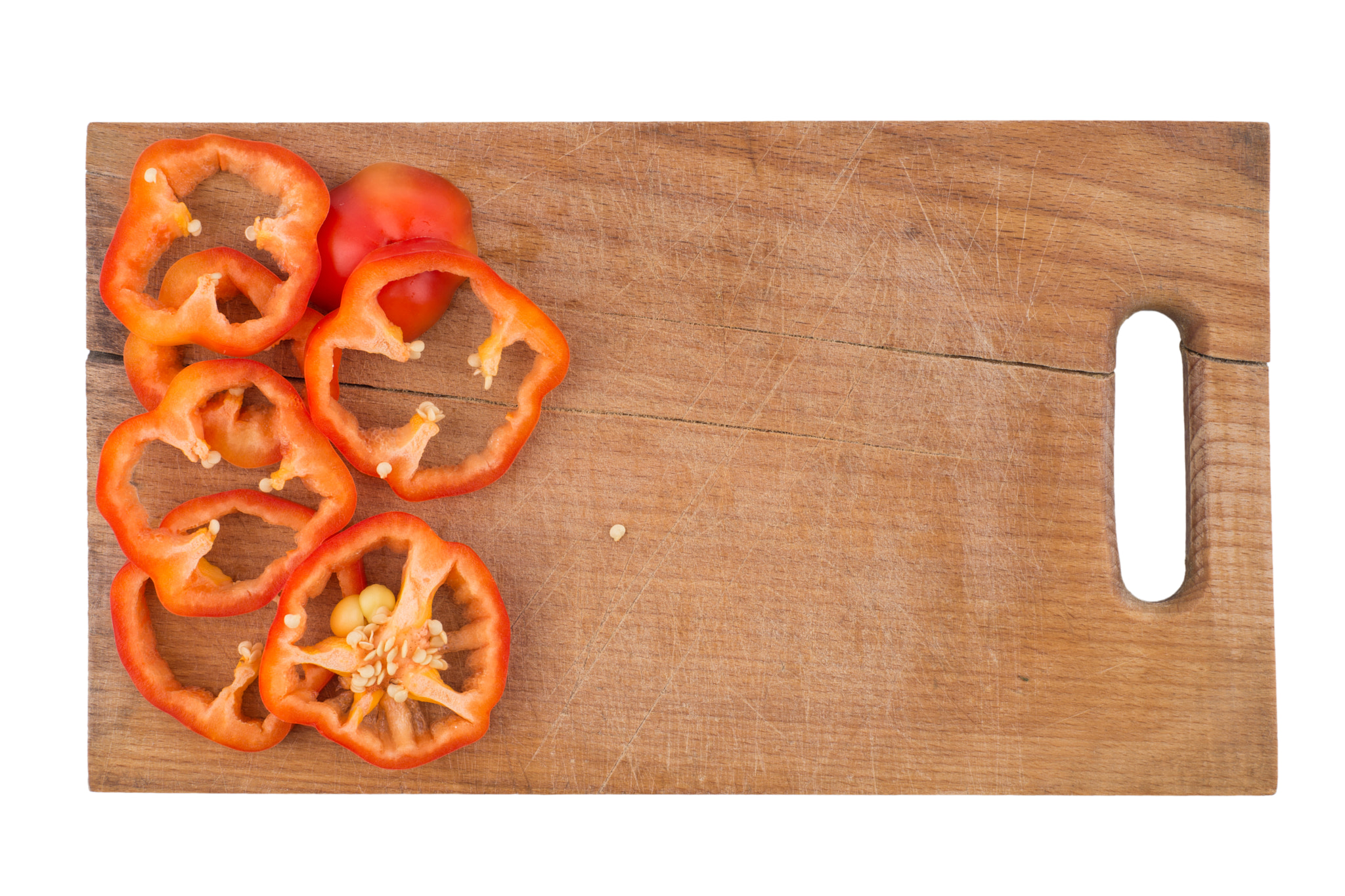 Sony a99 II + Minolta AF 50mm F1.7 sample photo. Sliced bell pepper on old cutting board. isolated on white backg photography