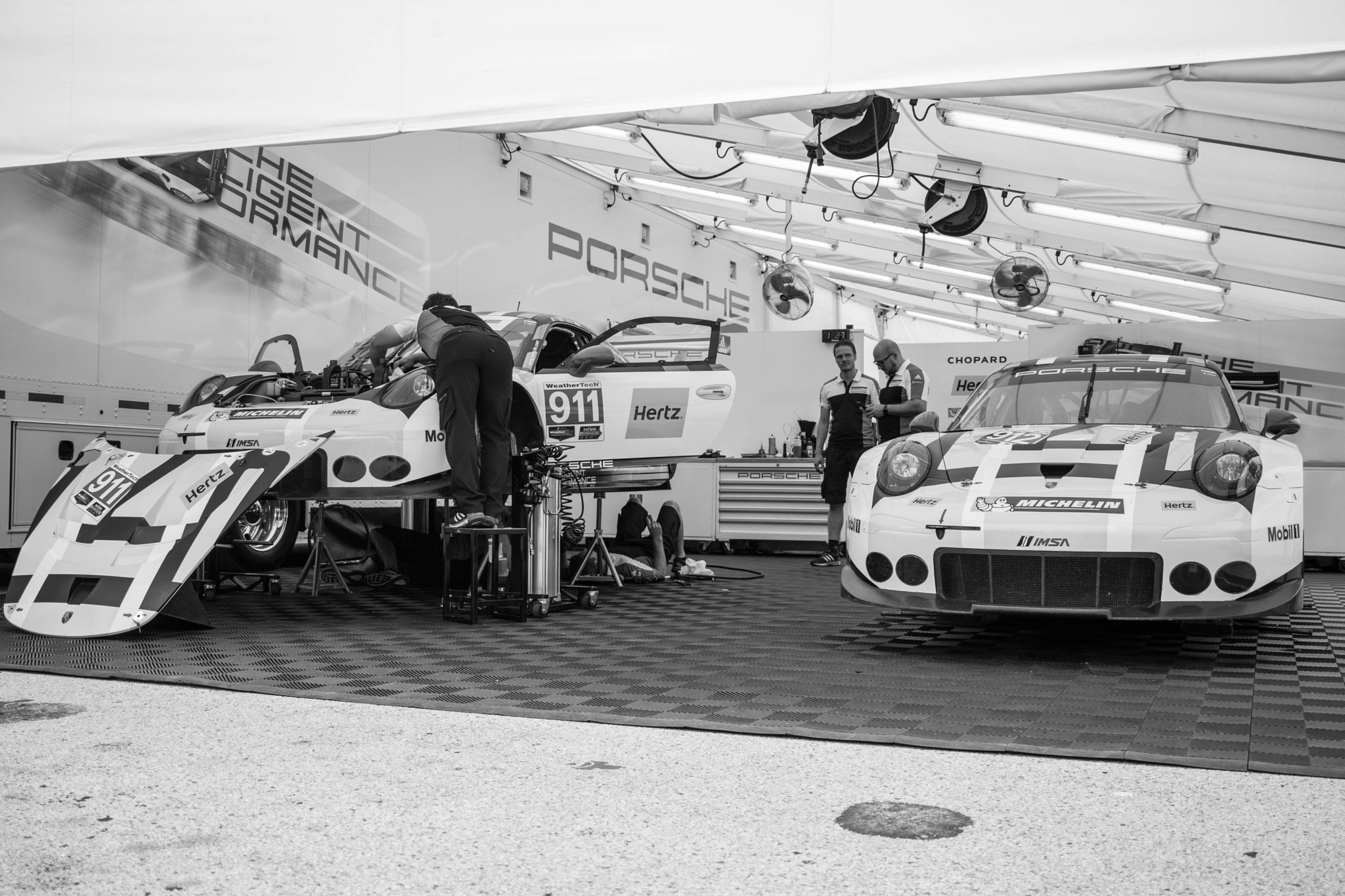 Canon EOS 750D (EOS Rebel T6i / EOS Kiss X8i) + Canon EF-S 24mm F2.8 STM sample photo. Porsche paddock at road america photography