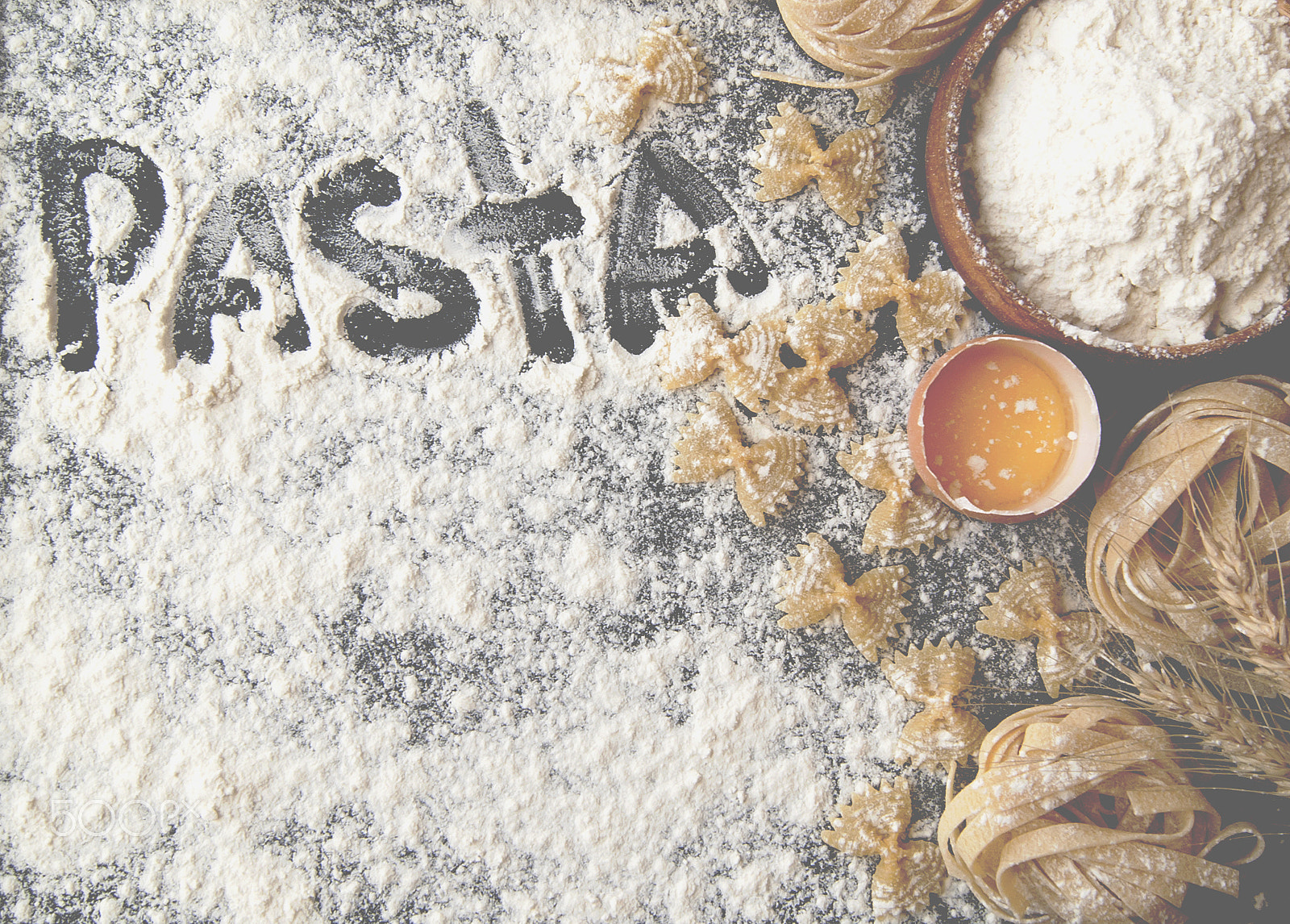 Sony Alpha DSLR-A380 sample photo. Uncooked pasta with flour on the table, selective focus photography