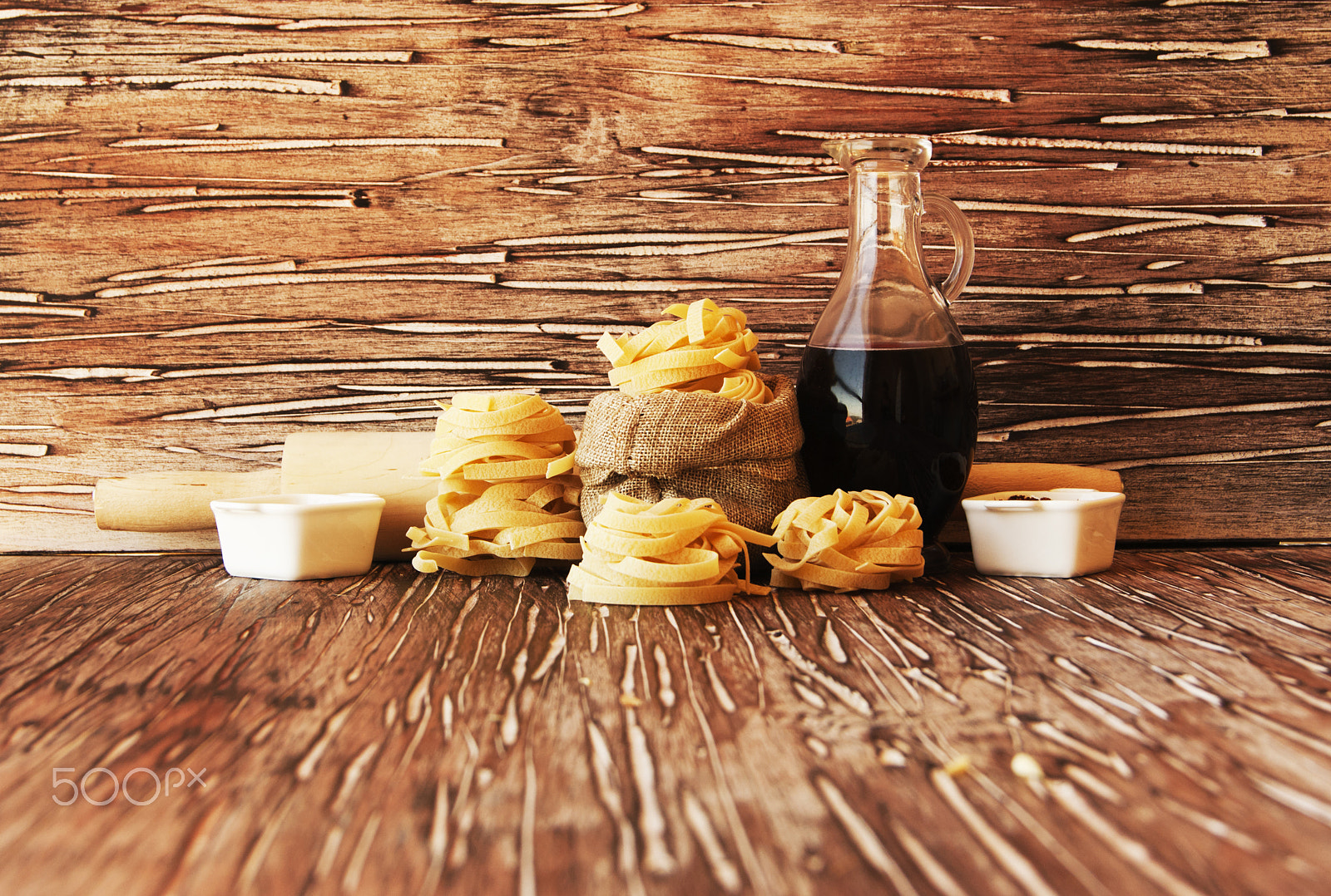 Sony Alpha DSLR-A380 sample photo. Uncooked pasta with flour on the table, selective focus photography