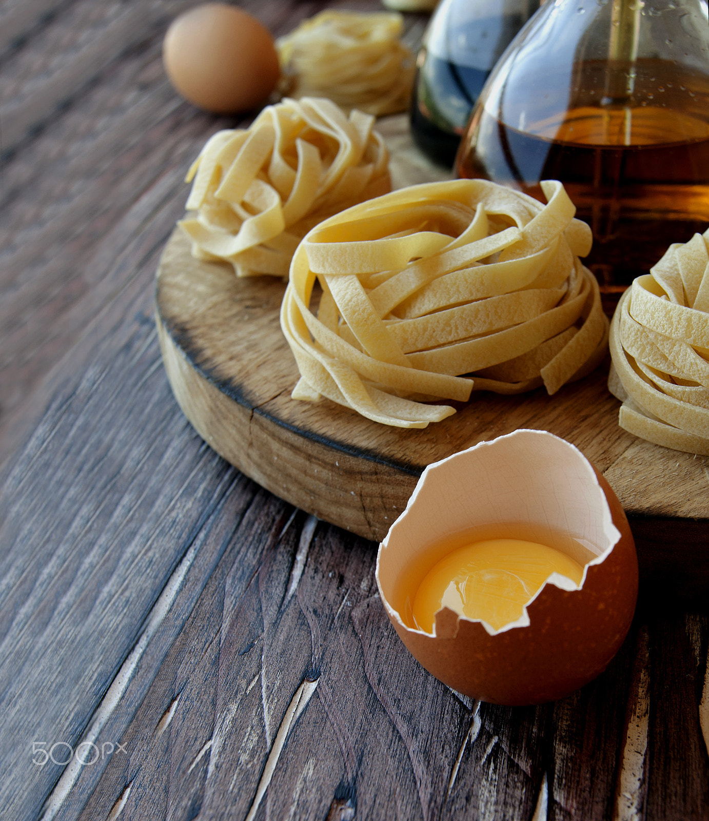 Sony Alpha DSLR-A380 sample photo. Uncooked pasta with flour on the table, selective focus photography