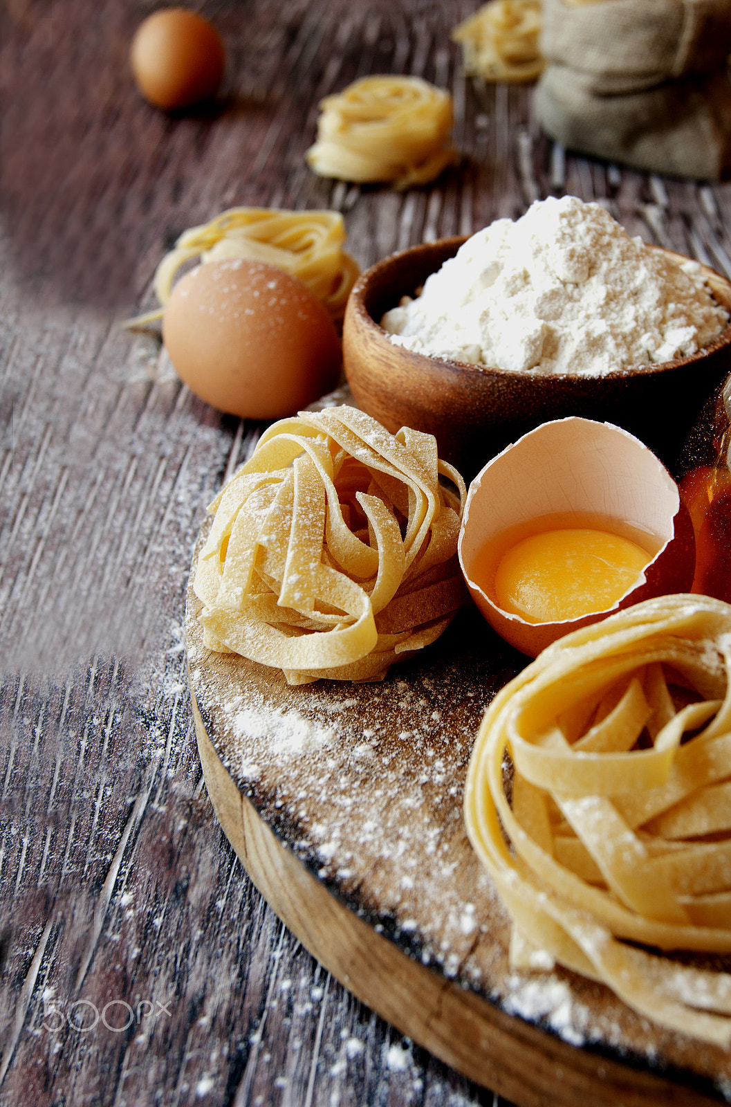Sony Alpha DSLR-A380 sample photo. Uncooked pasta with flour on the table, selective focus photography