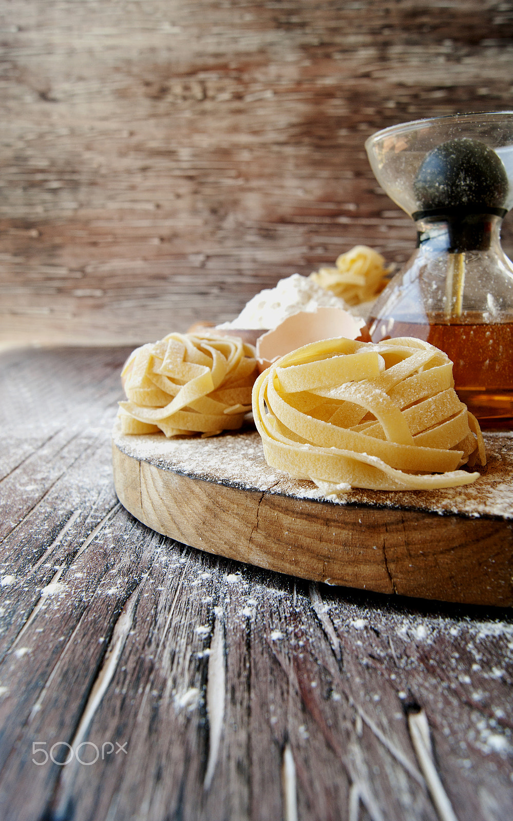 Sony Alpha DSLR-A380 sample photo. Uncooked pasta with flour on the table, selective focus photography