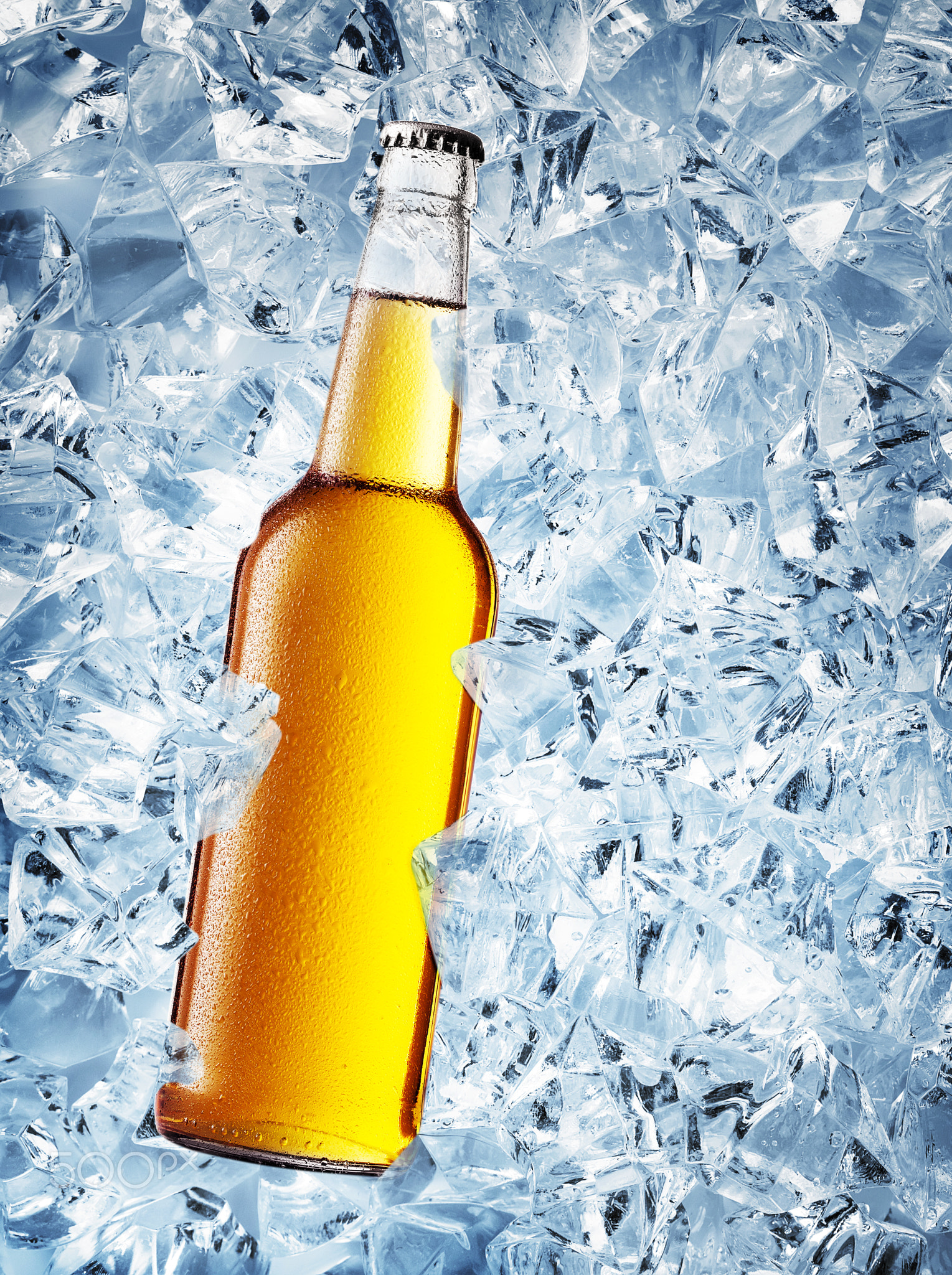 Yellow bottle of beer with drops