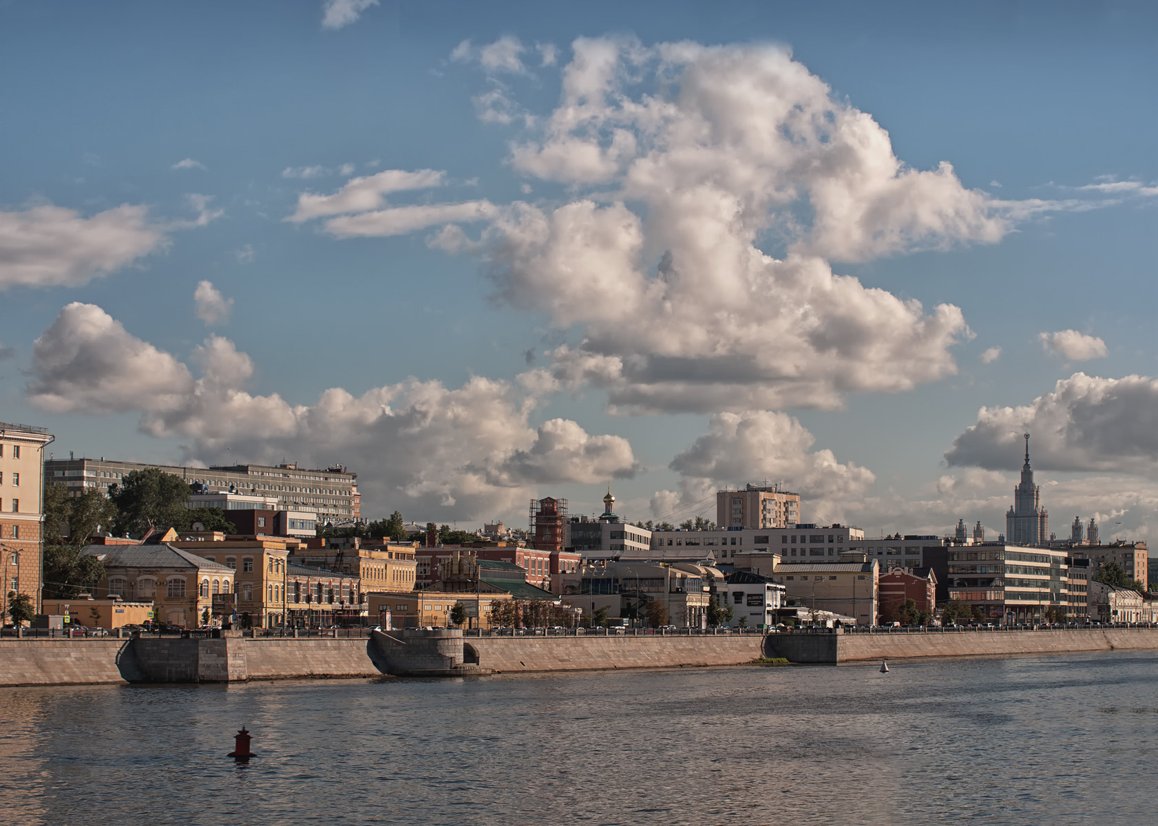 Panasonic Lumix DMC-GF2 + OLYMPUS DIGITAL 40-150mm Lens sample photo. About clouds and the city photography