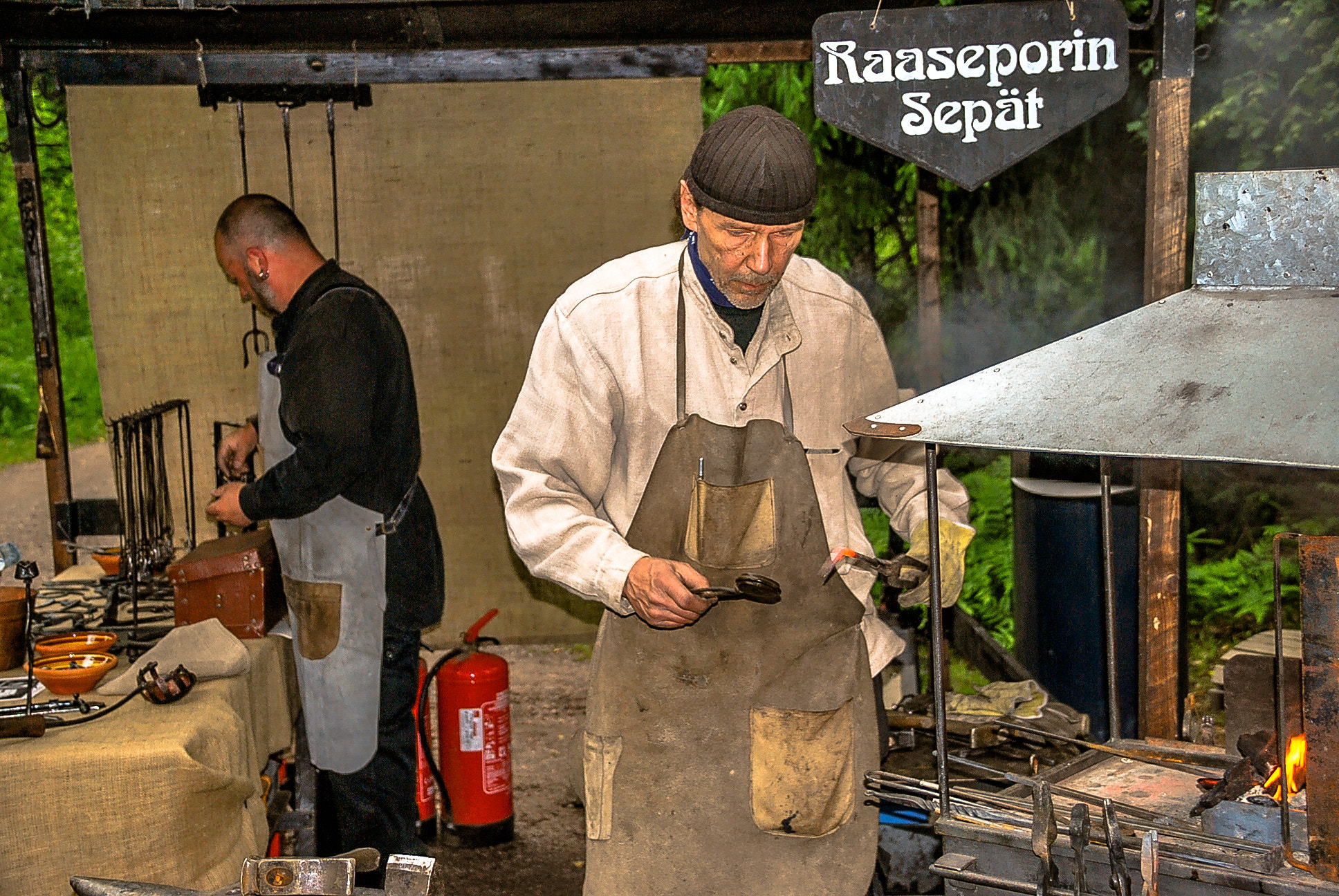 Sigma 18-125mm F3.8-5.6 DC OS HSM sample photo. Blacksmith working photography