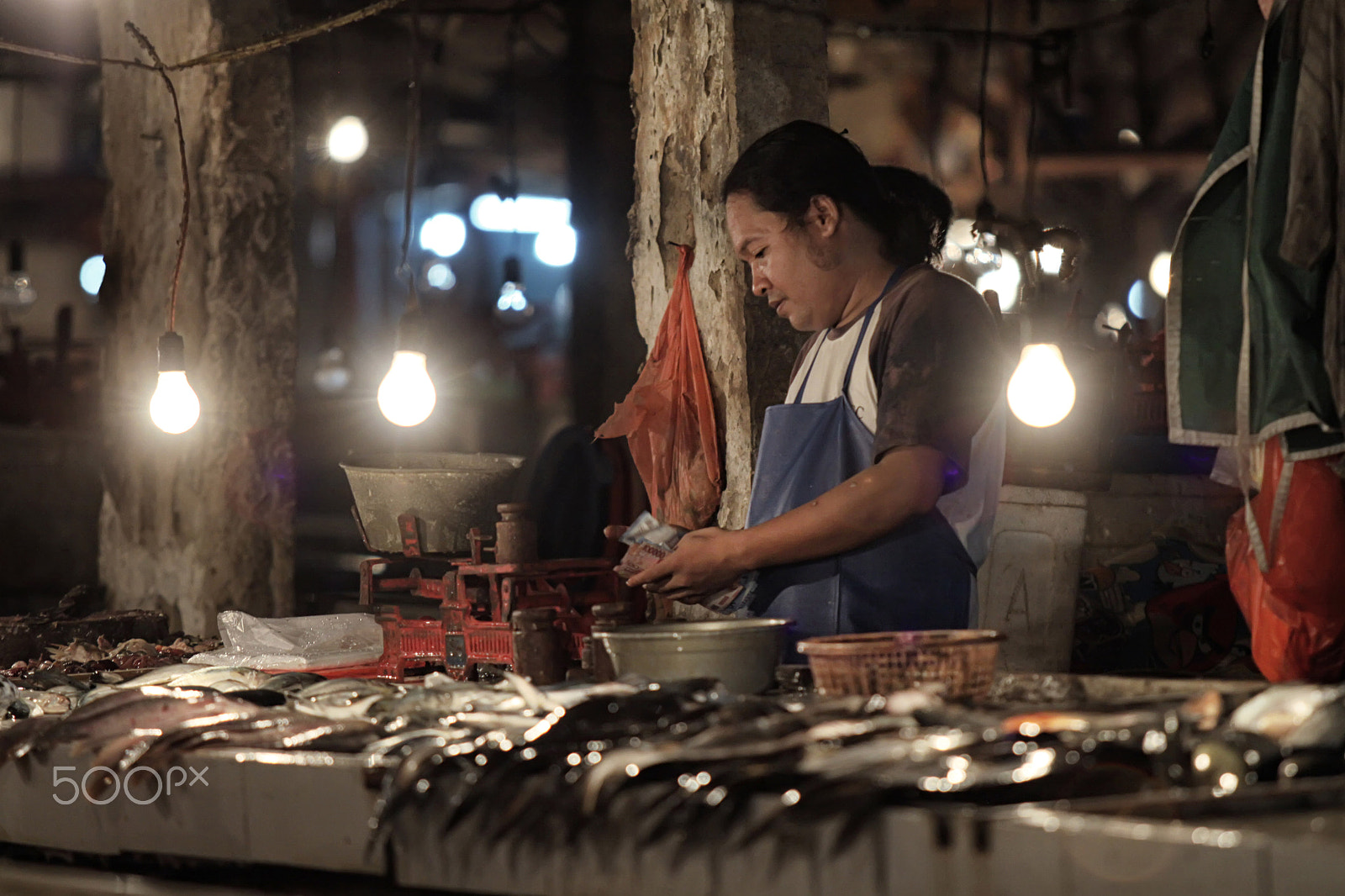 Canon EF 70-200mm F2.8L USM sample photo. Fish stall owner photography