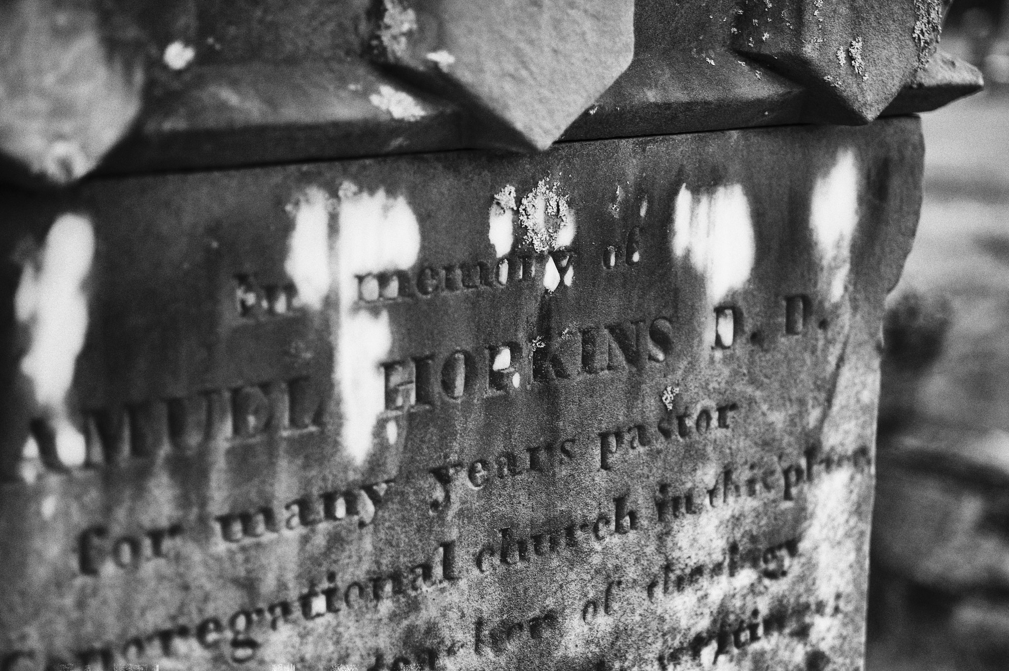 AF Zoom-Nikkor 28-70mm f/3.5-4.5D sample photo. The words tell a story, the stone gives texture. photography