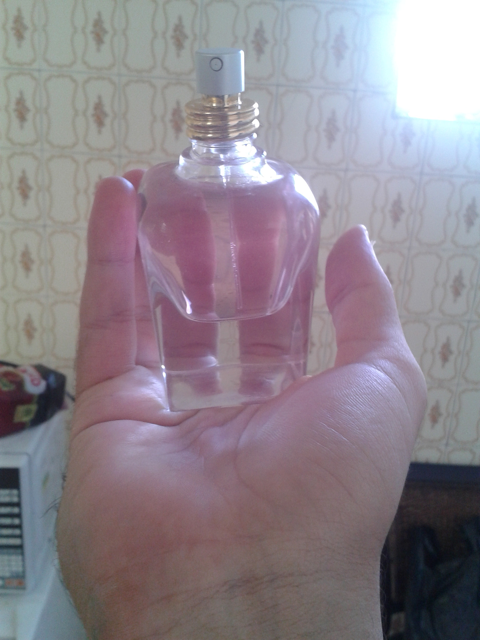 Samsung SGH-i677 sample photo. Holding perfume photography