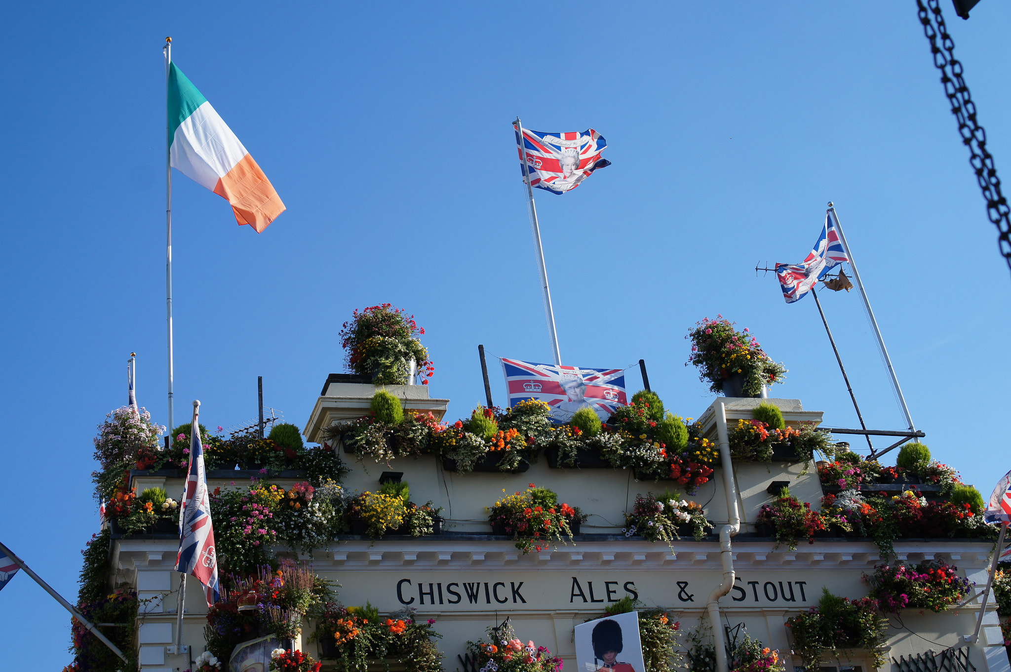 Sony Alpha NEX-C3 + Sony E 35mm F1.8 OSS sample photo. Flags and flowers photography