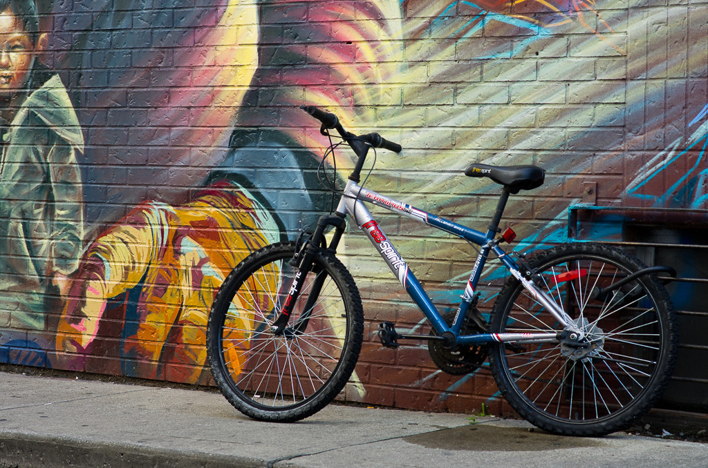 Pentax K-5 + Pentax smc DA 70mm F2.4 AL Limited sample photo. Bike leaning on a wall. photography