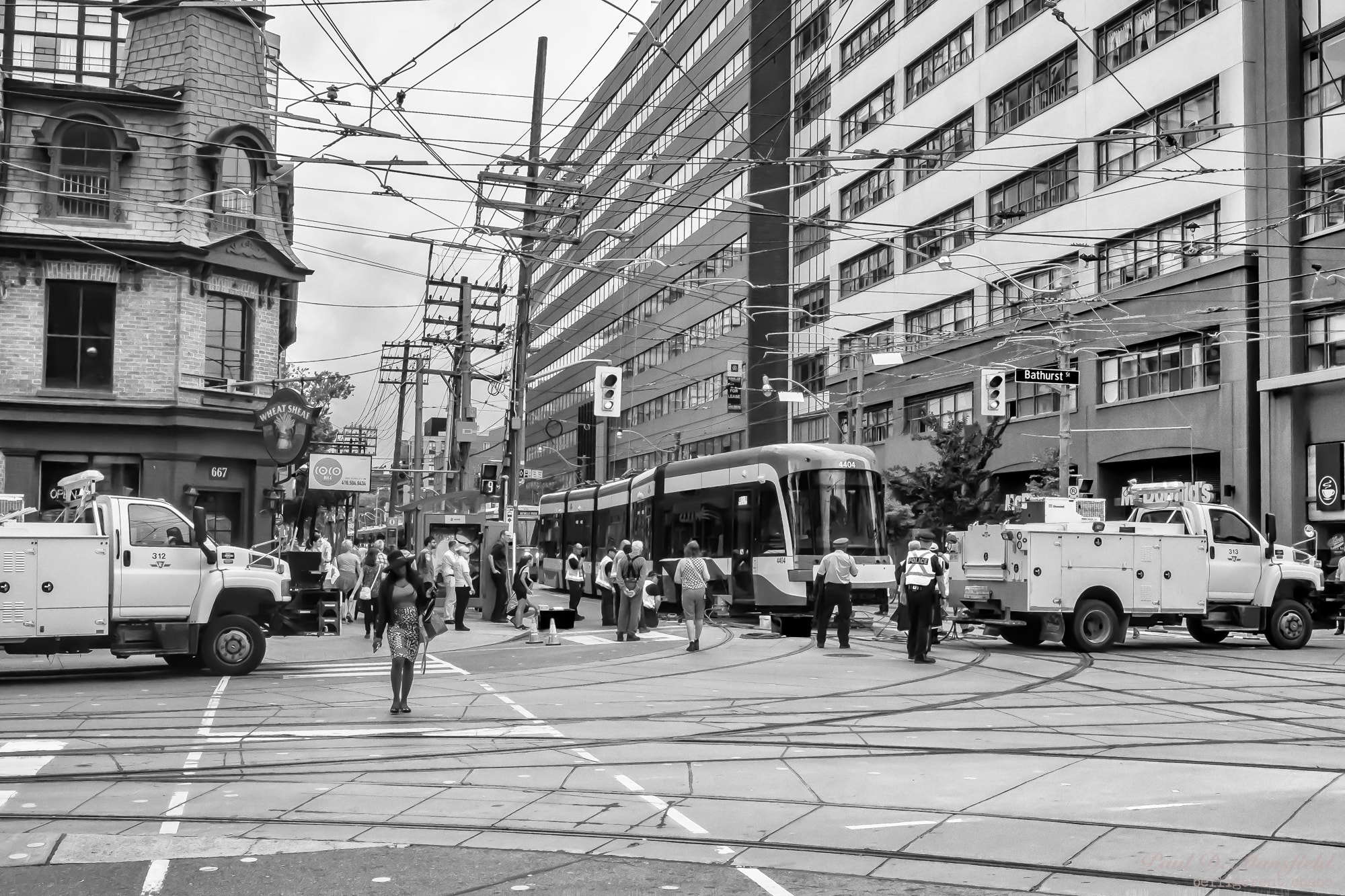 Fujifilm X-A1 + Fujifilm XF 27mm F2.8 sample photo. A new ttc streetcar, from bombardier broken down at king st w and bathurst.  the whole block was... photography