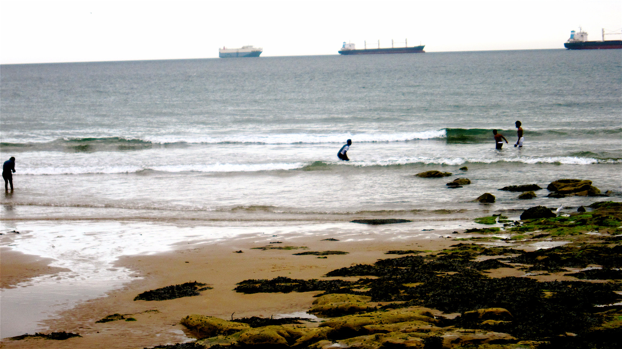 Canon PowerShot SD4000 IS (IXUS 300 HS / IXY 30S) sample photo. Out at the beach and saw these dudes fully dressed ... photography