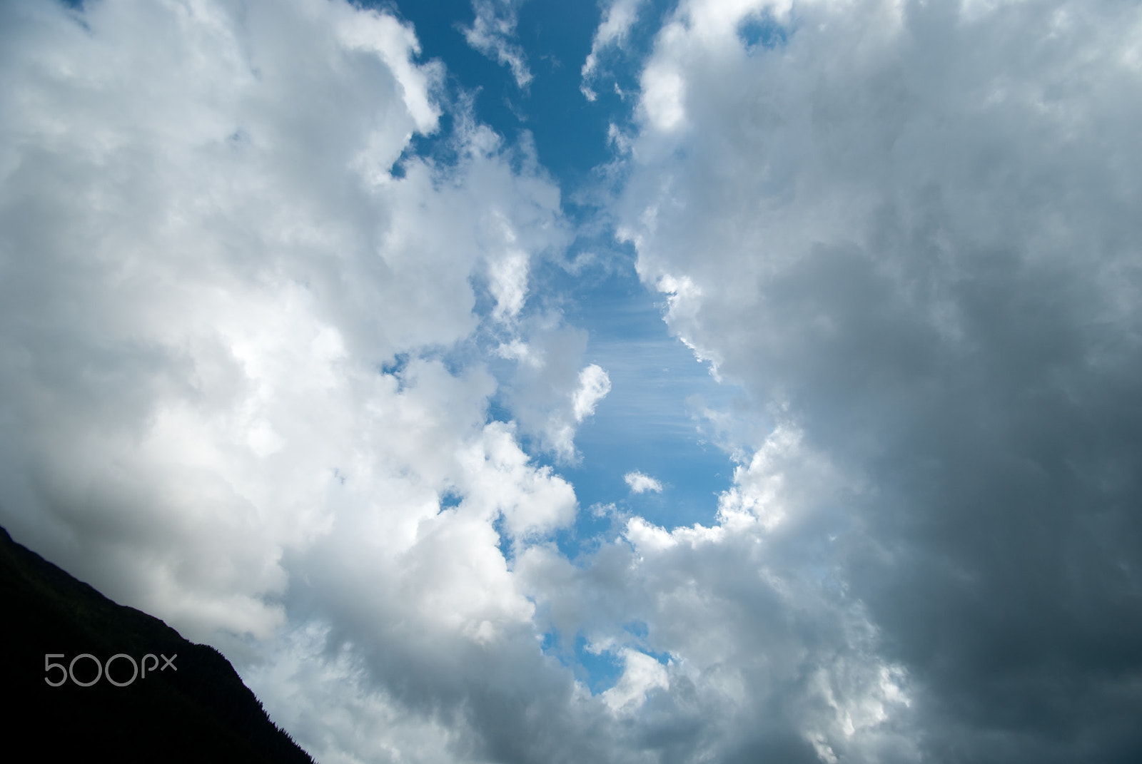 Nikon D40X sample photo. Hole in the clouds photography