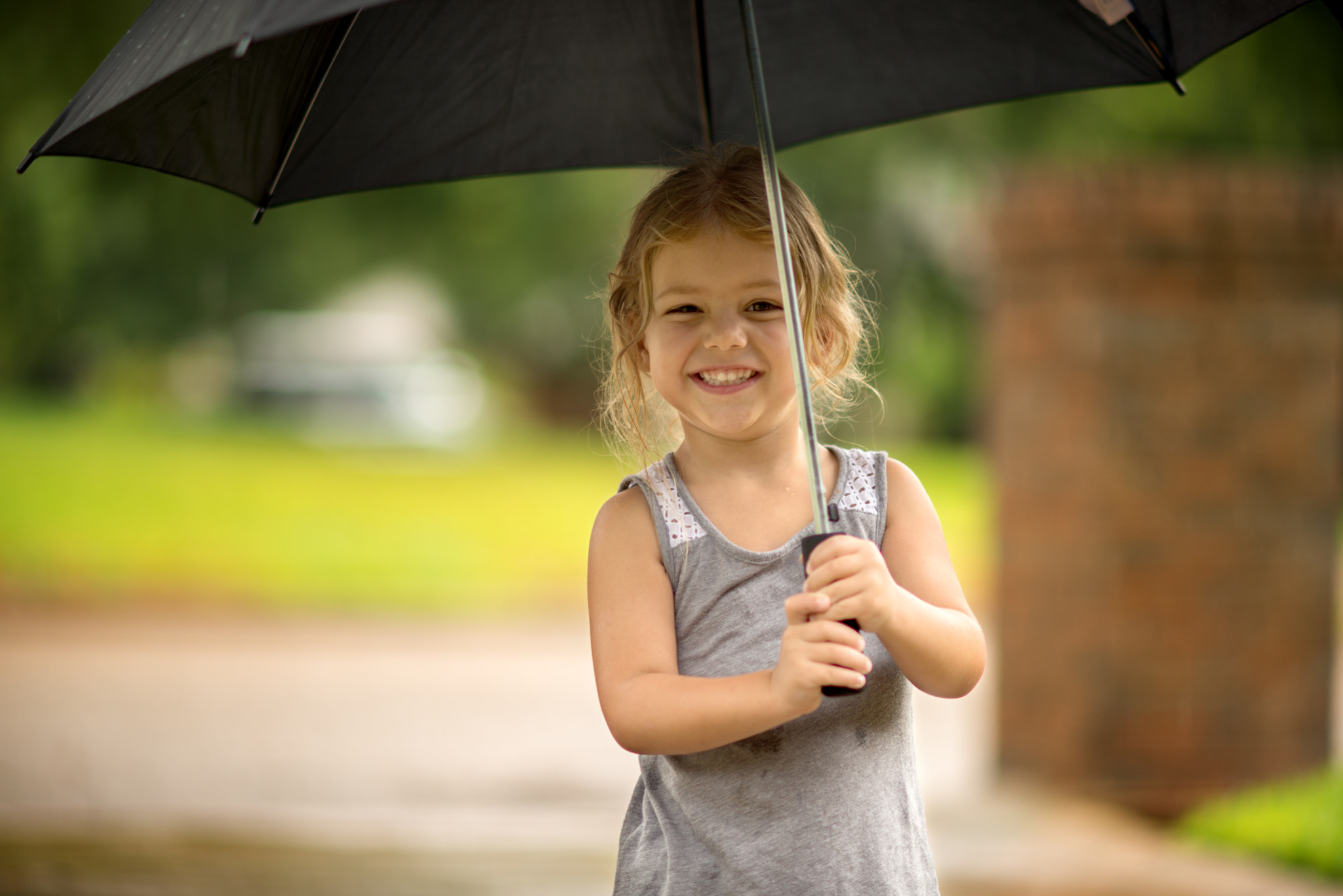 Nikon D610 sample photo. Reese under an umbrella photography