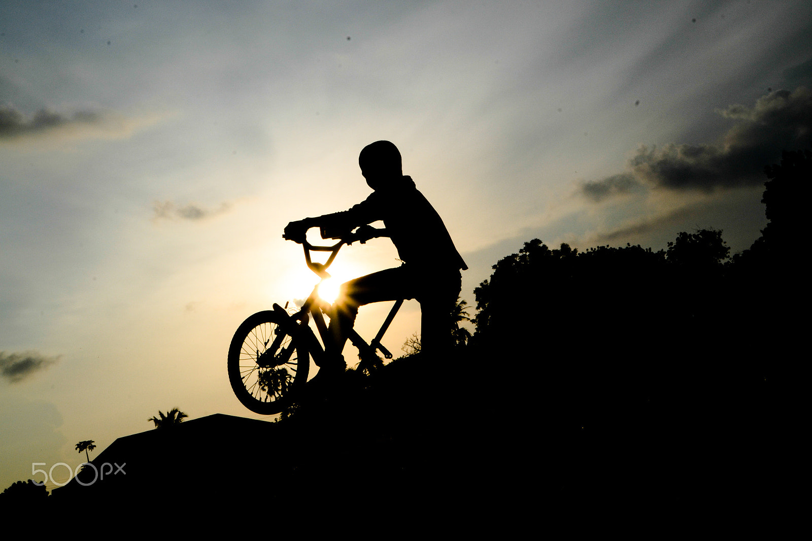 Nikon D3100 + Sigma 18-200mm F3.5-6.3 II DC OS HSM sample photo. Cycling at sunset photography