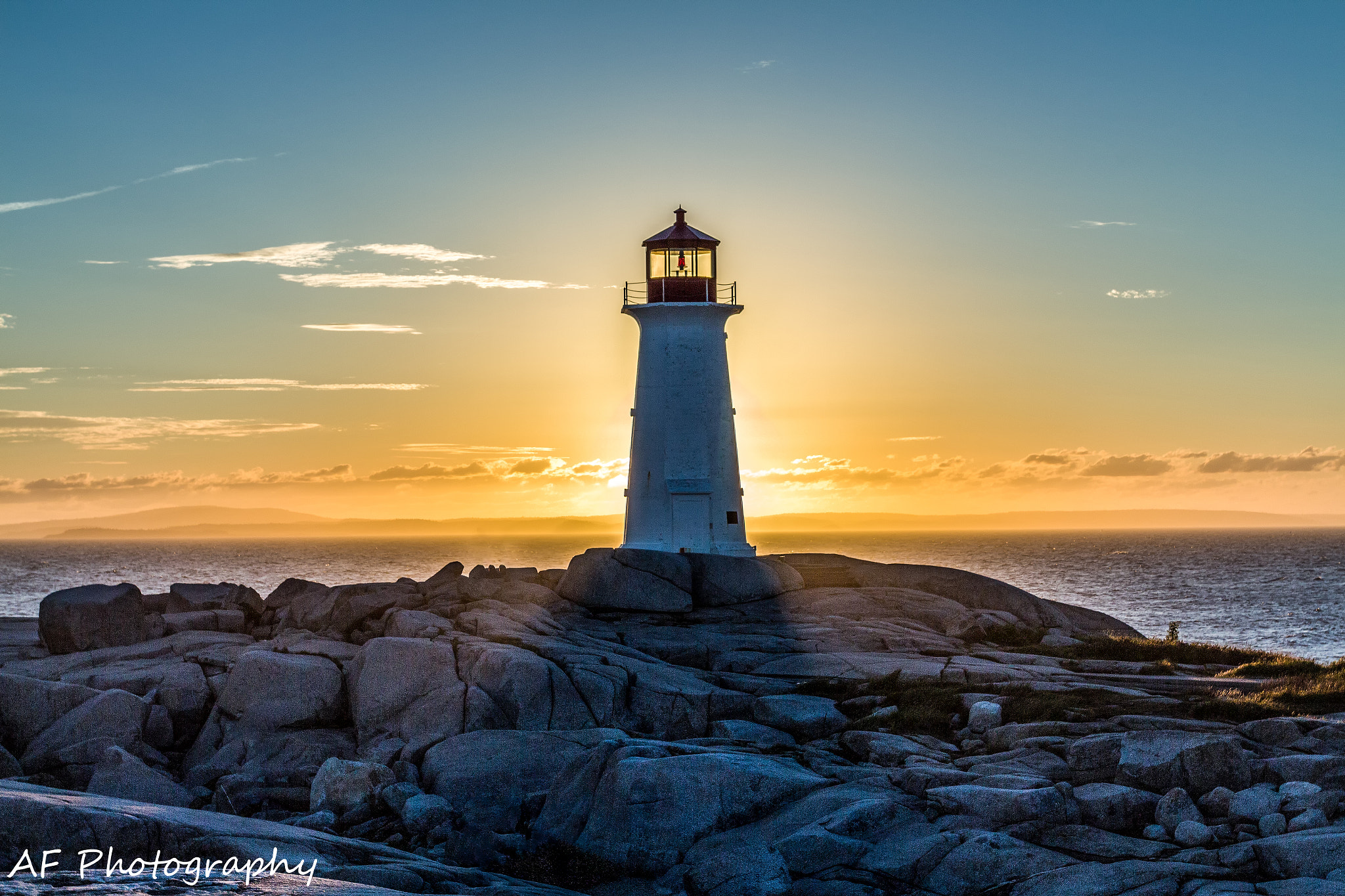 Canon EOS 650D (EOS Rebel T4i / EOS Kiss X6i) + Canon EF 17-40mm F4L USM sample photo. Peggys cove lighthouse nova scotia photography