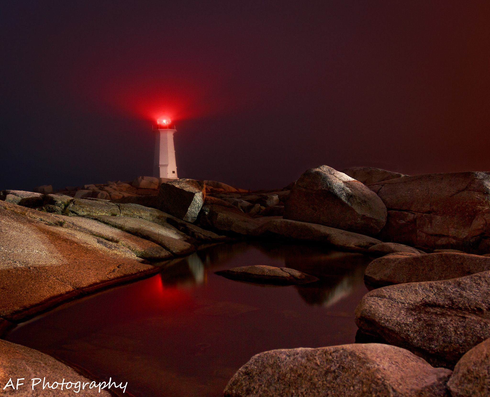 Canon EOS 650D (EOS Rebel T4i / EOS Kiss X6i) + Canon EF 17-40mm F4L USM sample photo. Peggys cove lighthouse night nova scotia photography