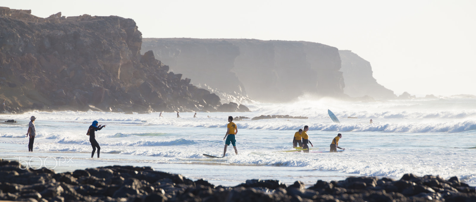 Canon EF 70-200mm F2.8L IS II USM sample photo. Surfers surfing on el cotillo beach, fuerteventura, canary islands, spain. photography