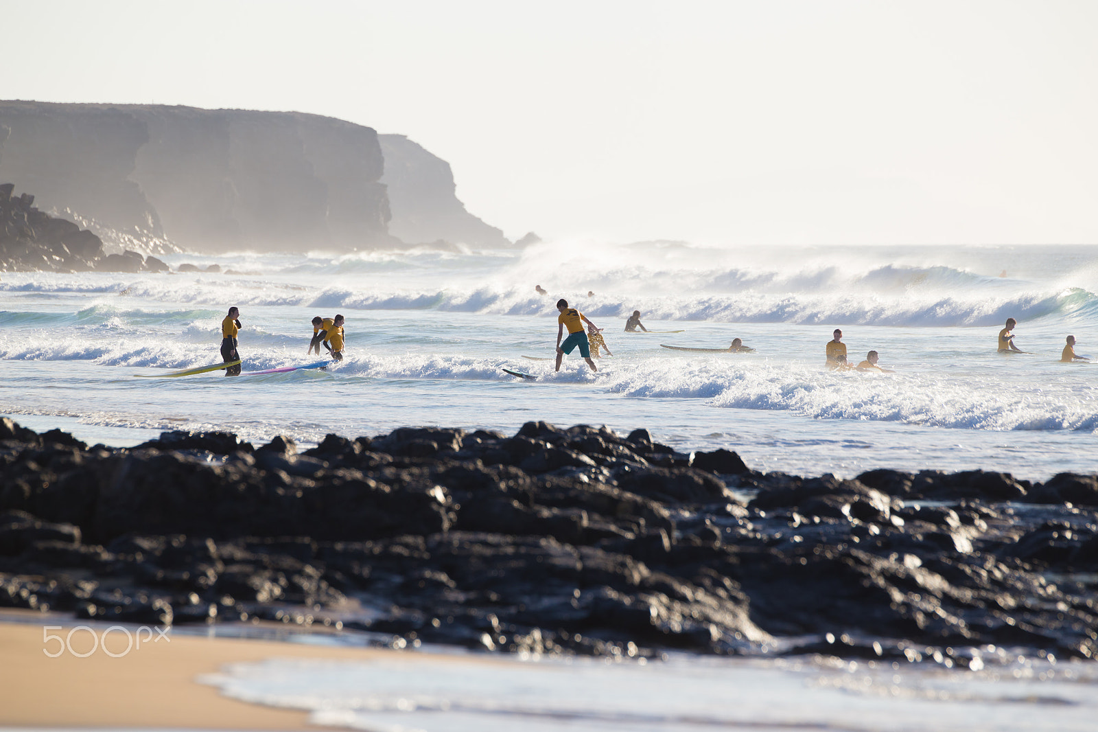 Canon EF 70-200mm F2.8L IS II USM sample photo. Surfers surfing on el cotillo beach, fuerteventura, canary islands, spain. photography