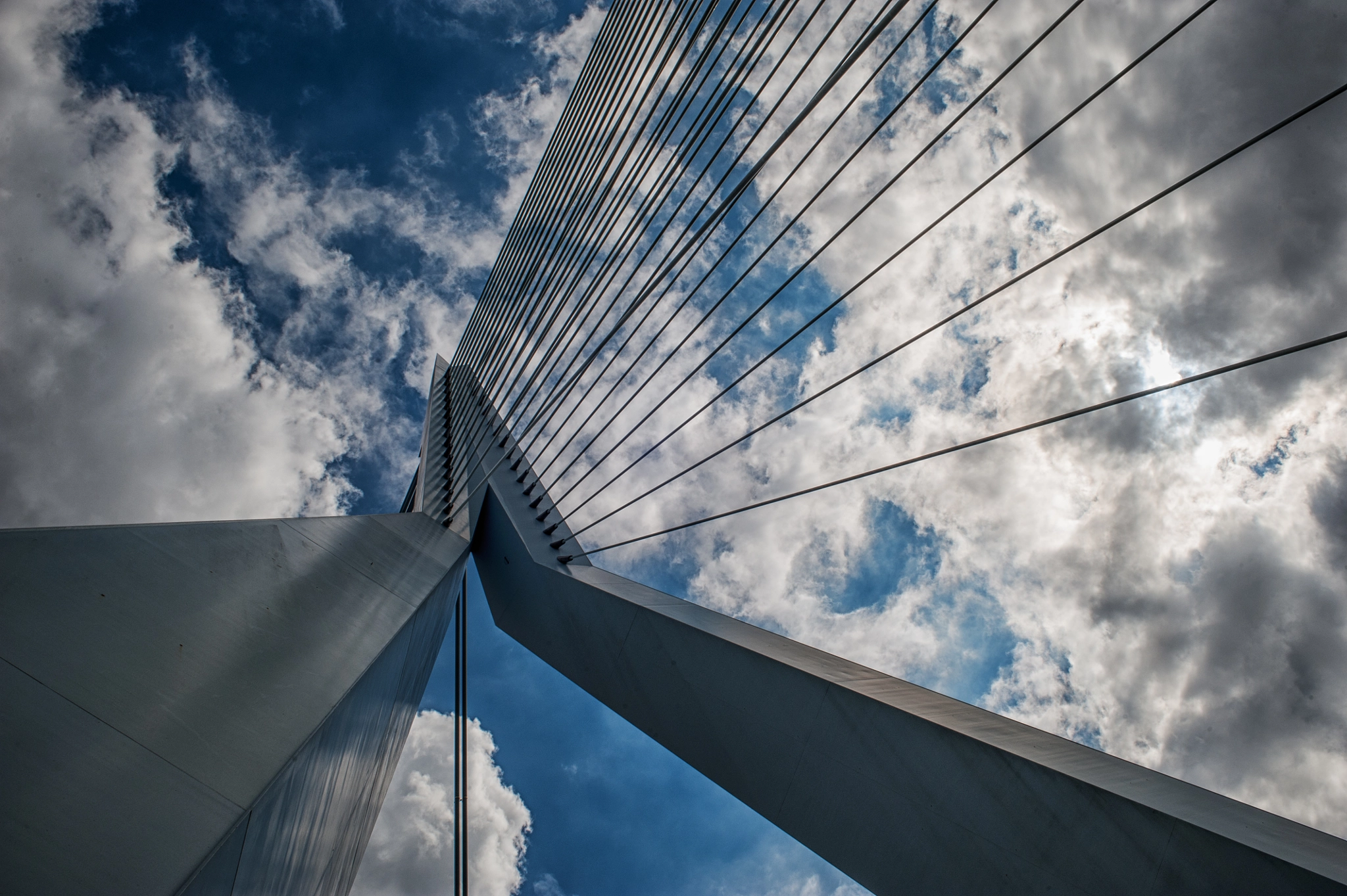 Nikon D700 + AF Nikkor 28mm f/2.8 sample photo. Erasmus bridge and clouds (rotterdam) photography