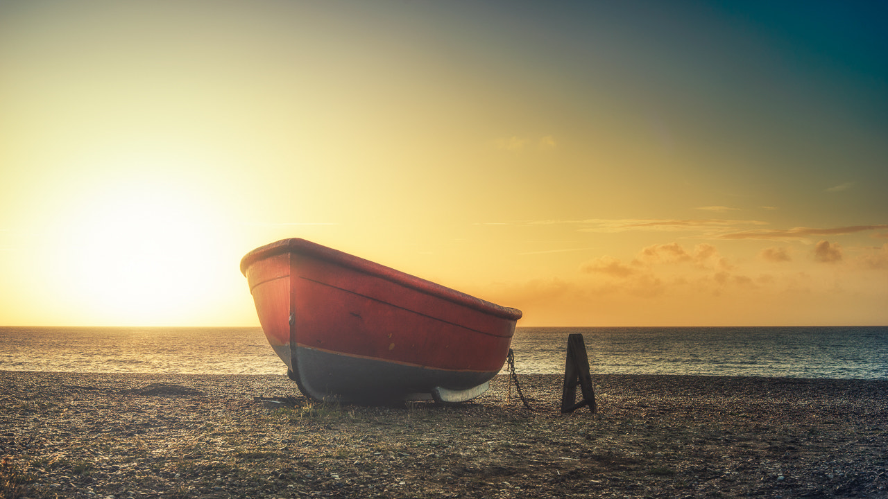 Sony a7 + E 50mm F1.4 sample photo. Sunrise boat photography