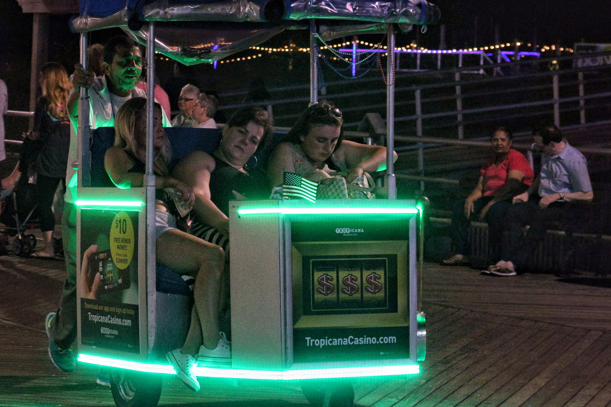 Canon EOS 650D (EOS Rebel T4i / EOS Kiss X6i) + Canon EF 70-300mm F4-5.6L IS USM sample photo. Rolling chair at night on the boardwalk photography