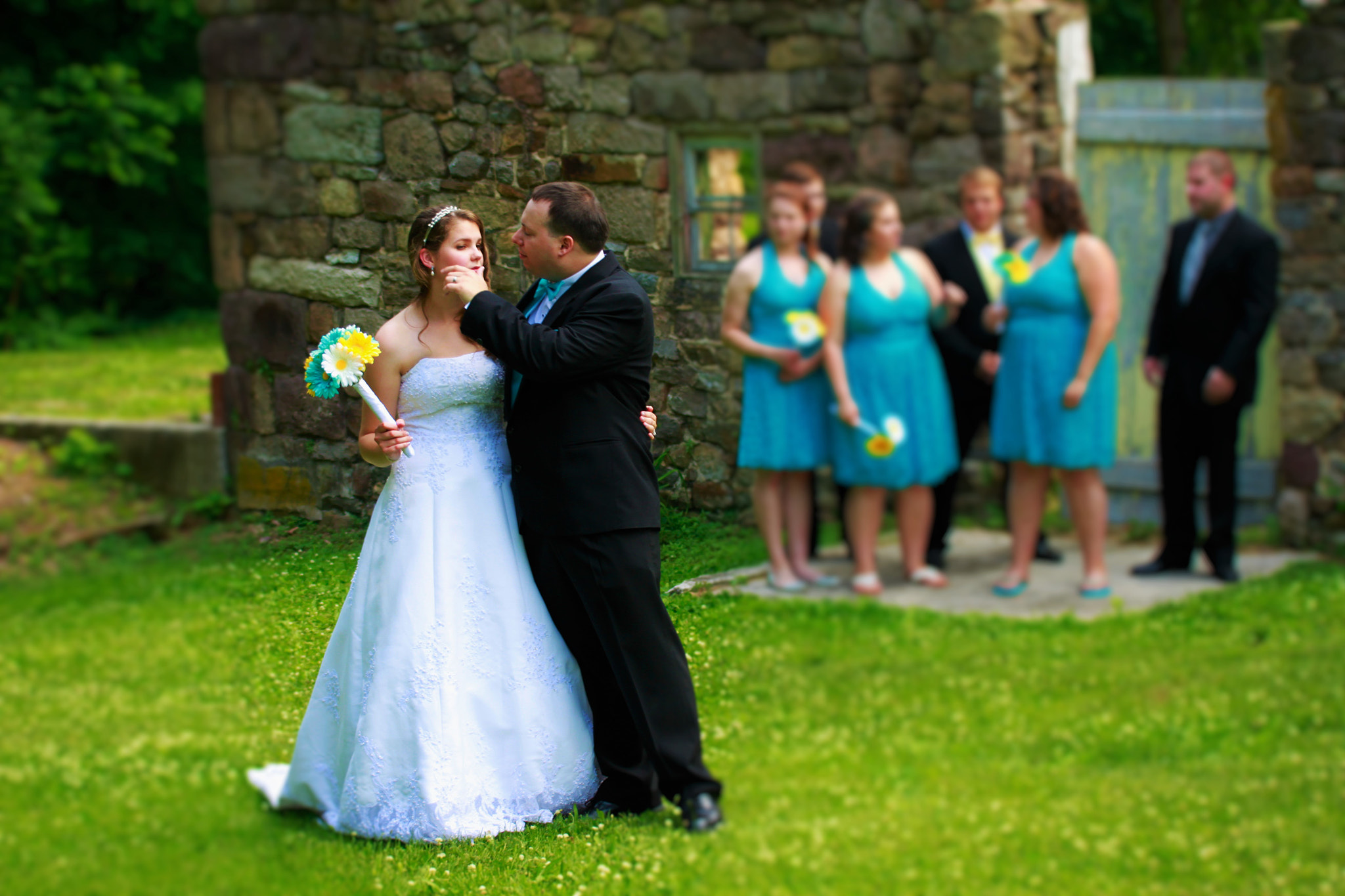 Canon EF 55-200mm f/4.5-5.6 sample photo. Tender attentive groom photography