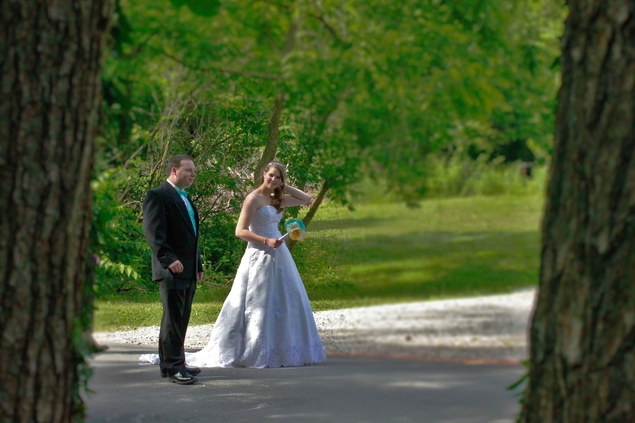 Canon EOS 500D (EOS Rebel T1i / EOS Kiss X3) + Canon EF 55-200mm f/4.5-5.6 sample photo. Bride & groom walk in woods photography