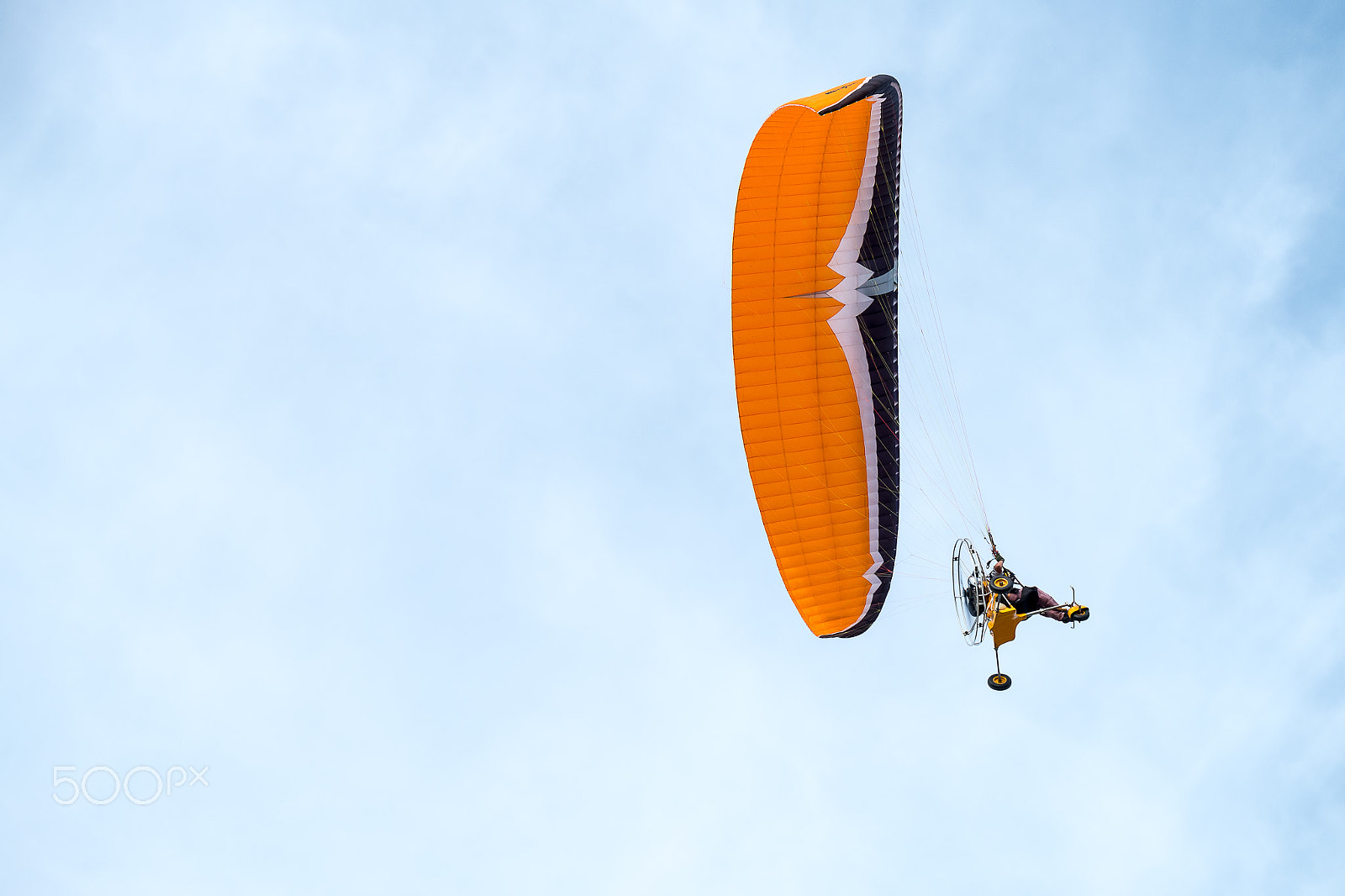 Fujifilm X-A2 + Fujifilm XC 50-230mm F4.5-6.7 OIS II sample photo. Paraglider flies on background of sunset sky photography