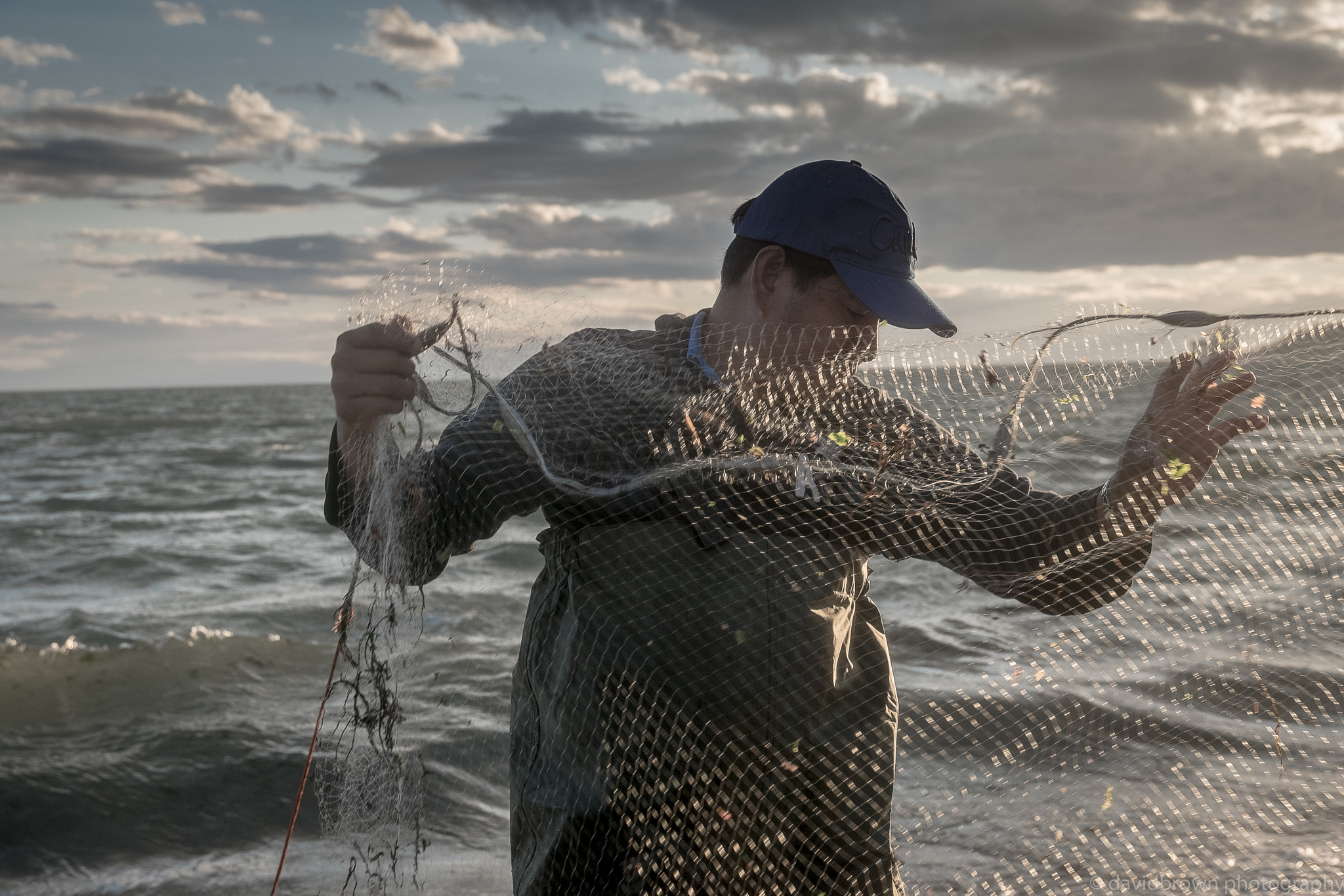 Sigma 17-70mm F2.8-4 DC Macro HSM sample photo. Tending his nets photography