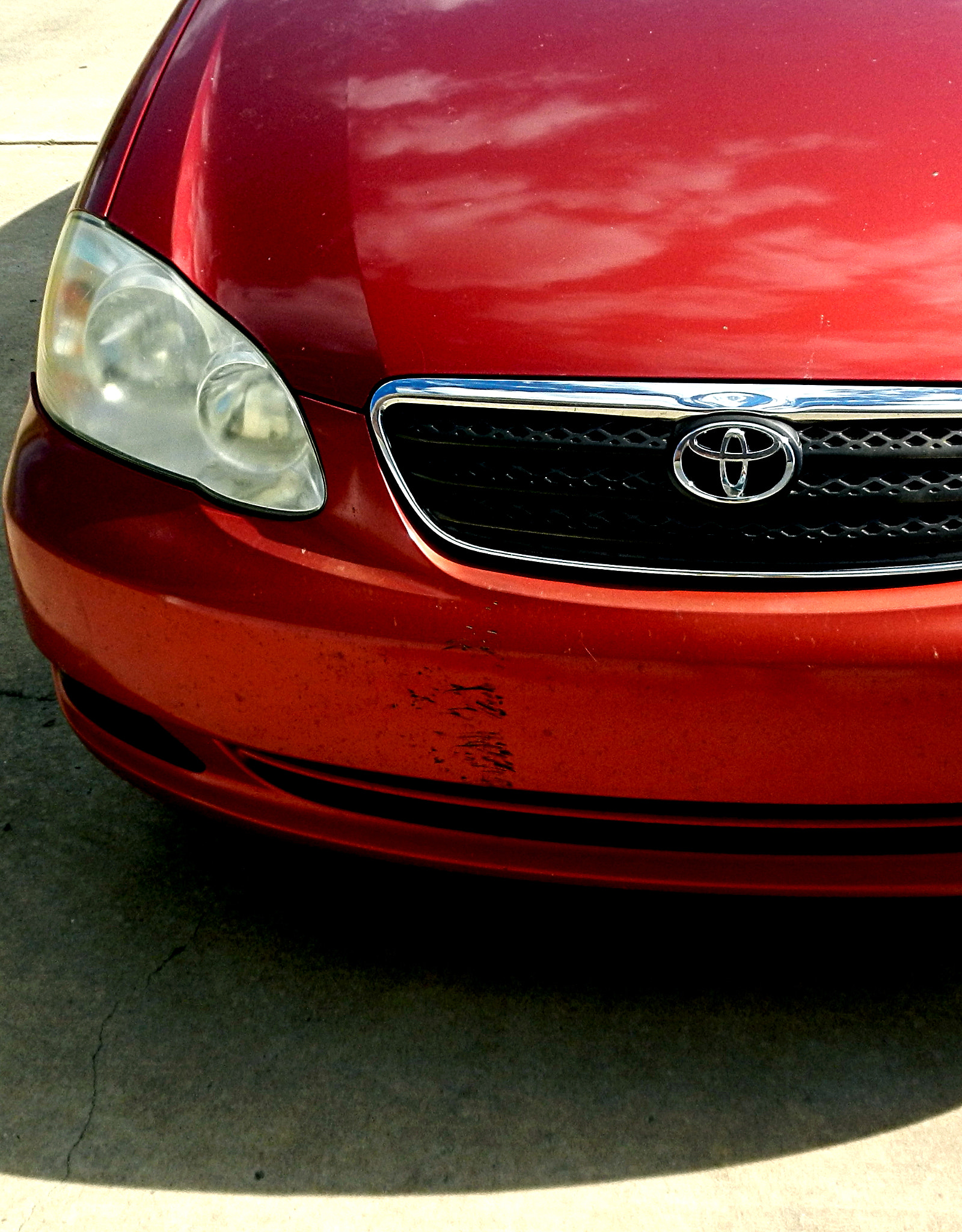 Nikon Coolpix S800c sample photo. Front of a red car photography