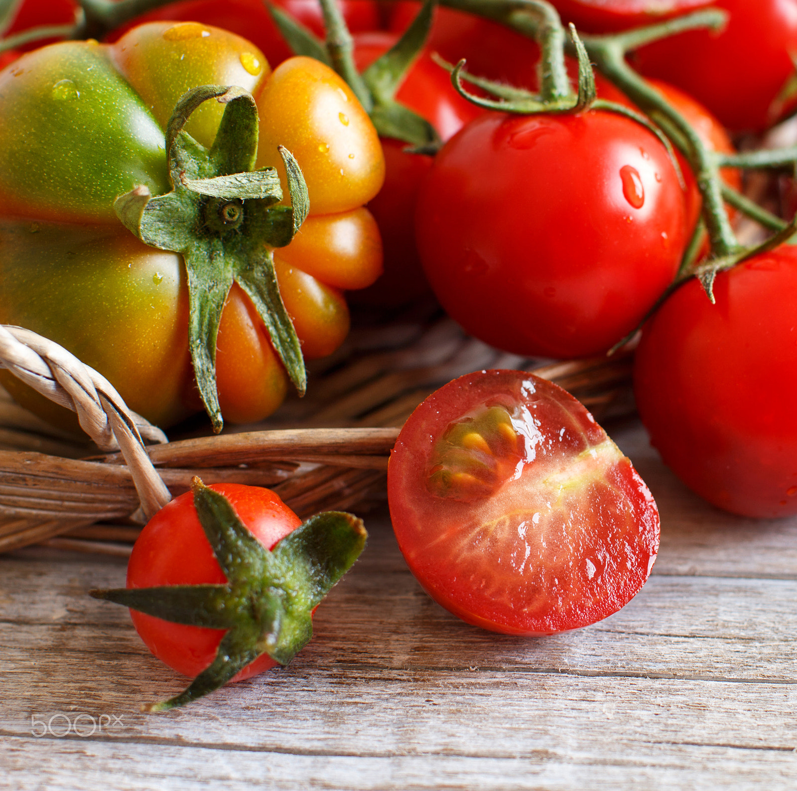 Canon EOS 650D (EOS Rebel T4i / EOS Kiss X6i) + Canon EF 50mm F1.2L USM sample photo. Tomatoes on a wooden table photography