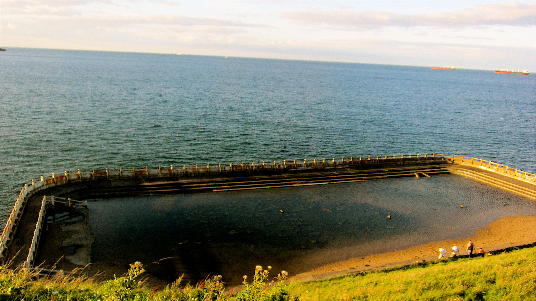 Canon PowerShot SD4000 IS (IXUS 300 HS / IXY 30S) sample photo. At the end of longsands beach is an out door swimm ... photography