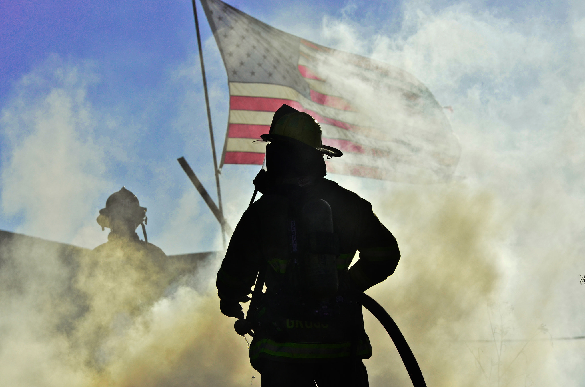 Nikon D5100 + Sigma 70-200mm F2.8 EX DG OS HSM sample photo. Richmond firefighter and the american flag photography