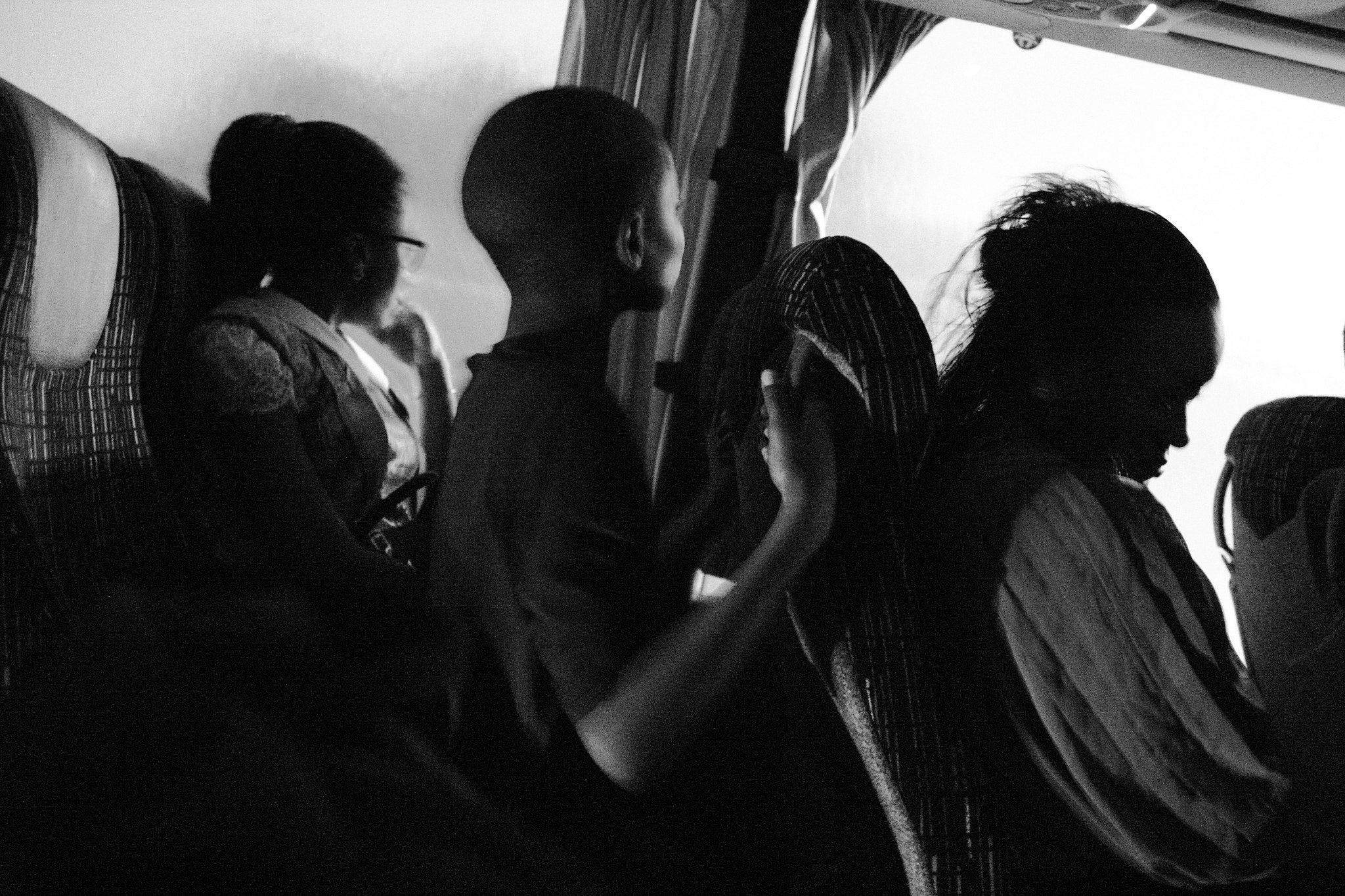 Canon EF 24mm F2.8 IS USM sample photo. An african family arrive for the first time in europe photography