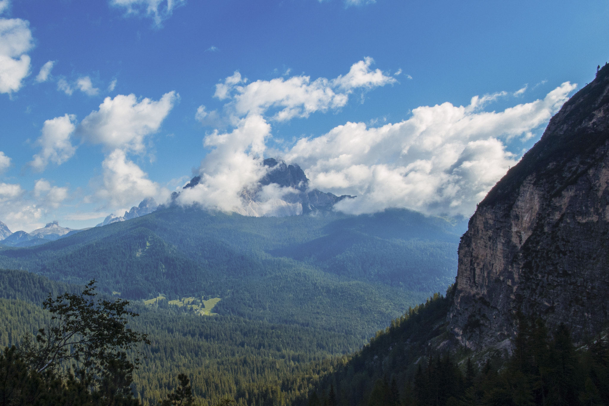 Sigma 17-70mm F2.8-4 DC Macro OS HSM sample photo. Mountains and clouds photography