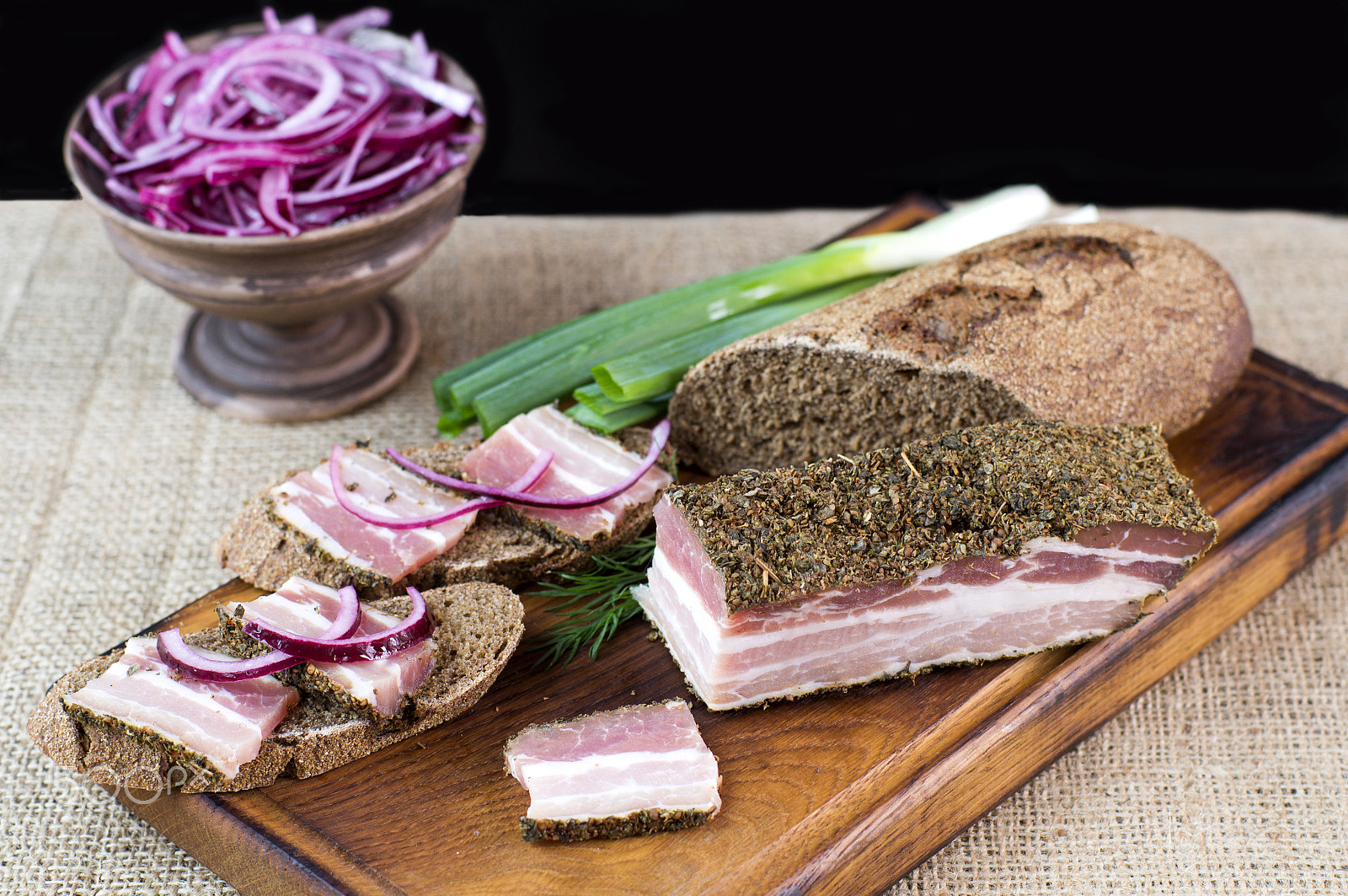 Sony SLT-A37 + Sony 50mm F1.4 sample photo. Smoked bacon with onion and rye bread photography