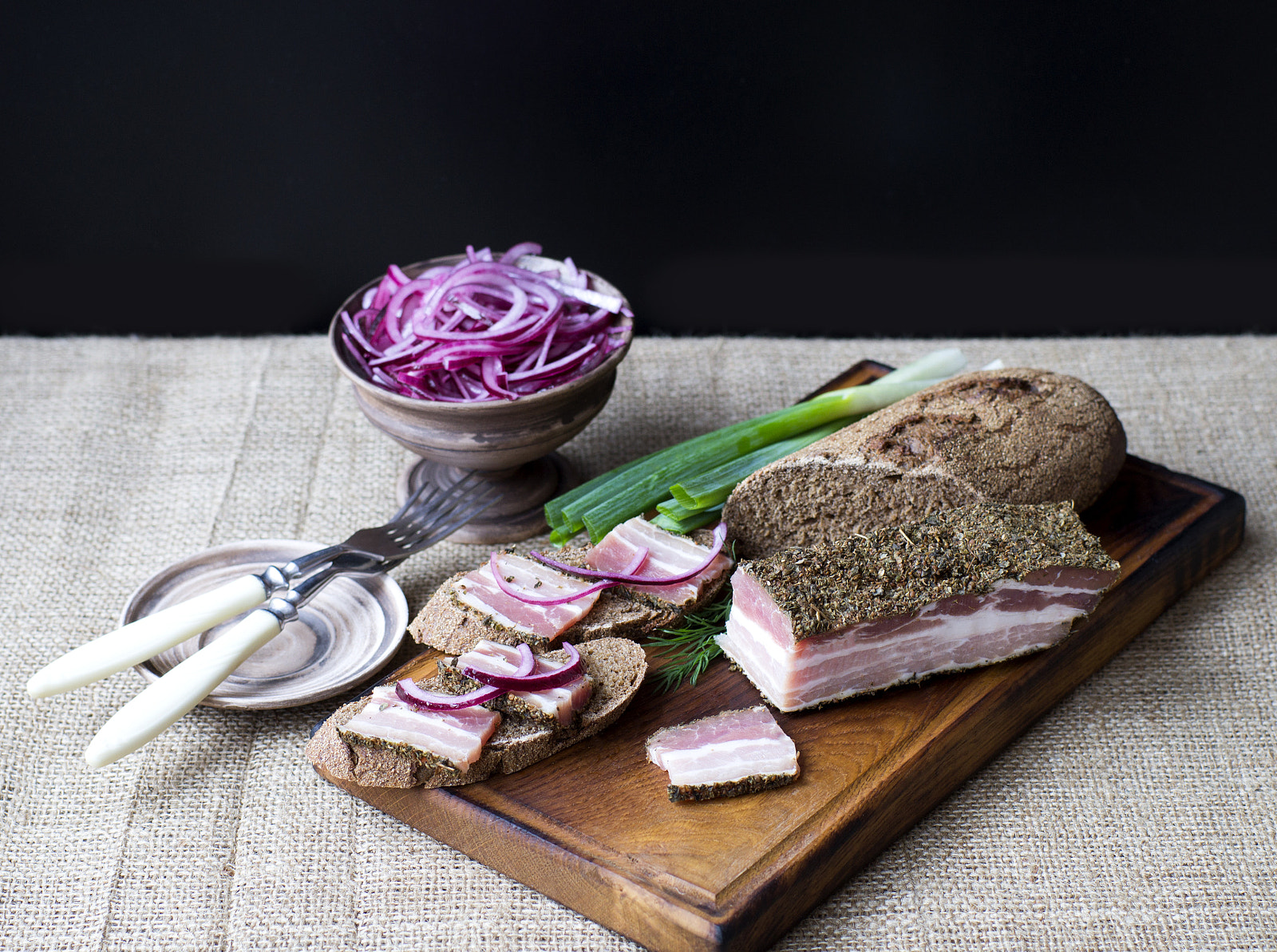 Sony SLT-A37 + Sony 50mm F1.4 sample photo. Smoked bacon with onion and rye bread photography