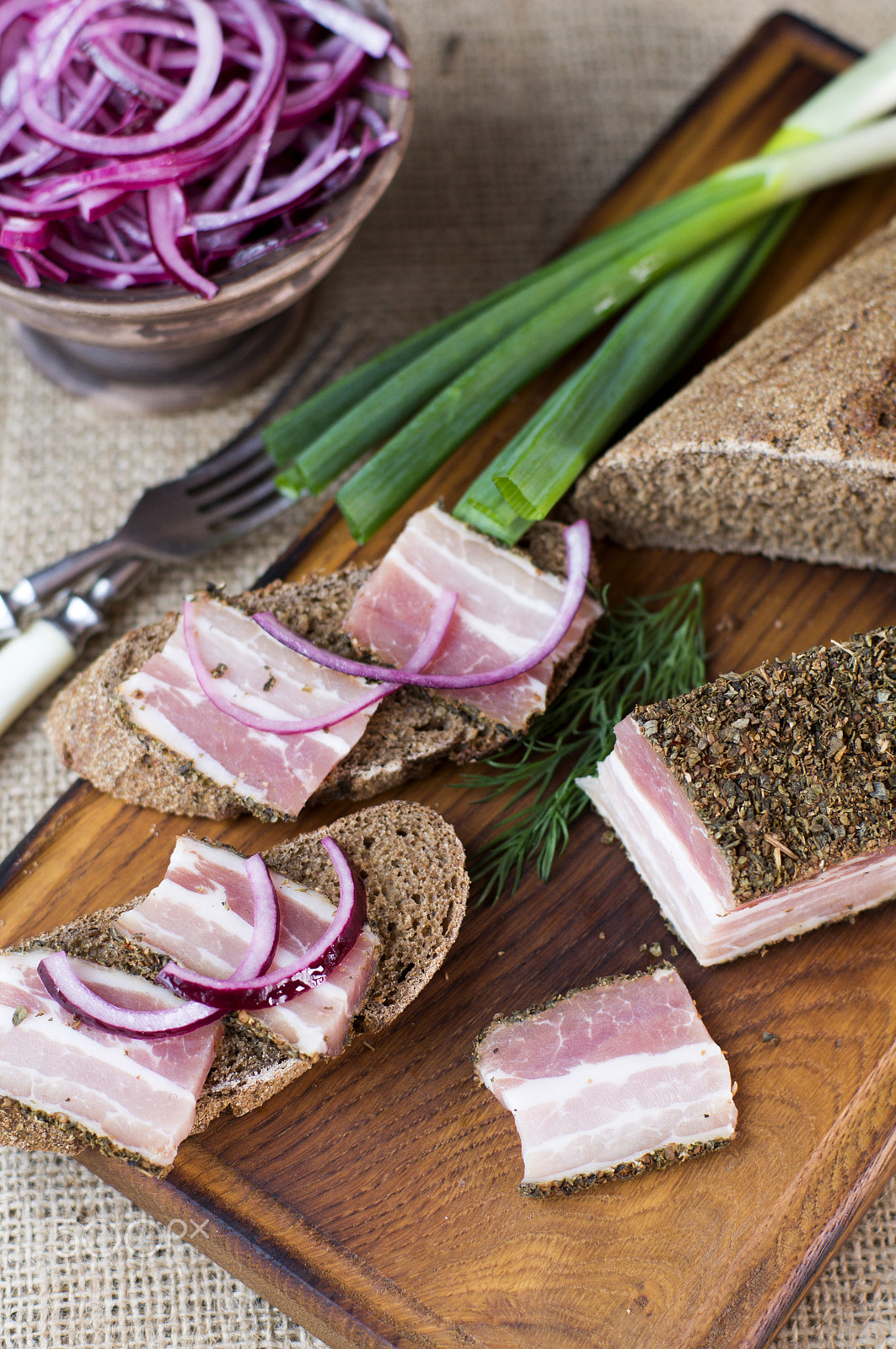 Sony SLT-A37 + Sony 50mm F1.4 sample photo. Smoked bacon with onion and rye bread photography