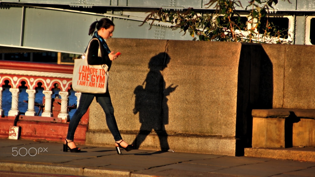 Sony SLT-A55 (SLT-A55V) + Sony DT 55-200mm F4-5.6 SAM sample photo. Shadow going to the gym with its human photography