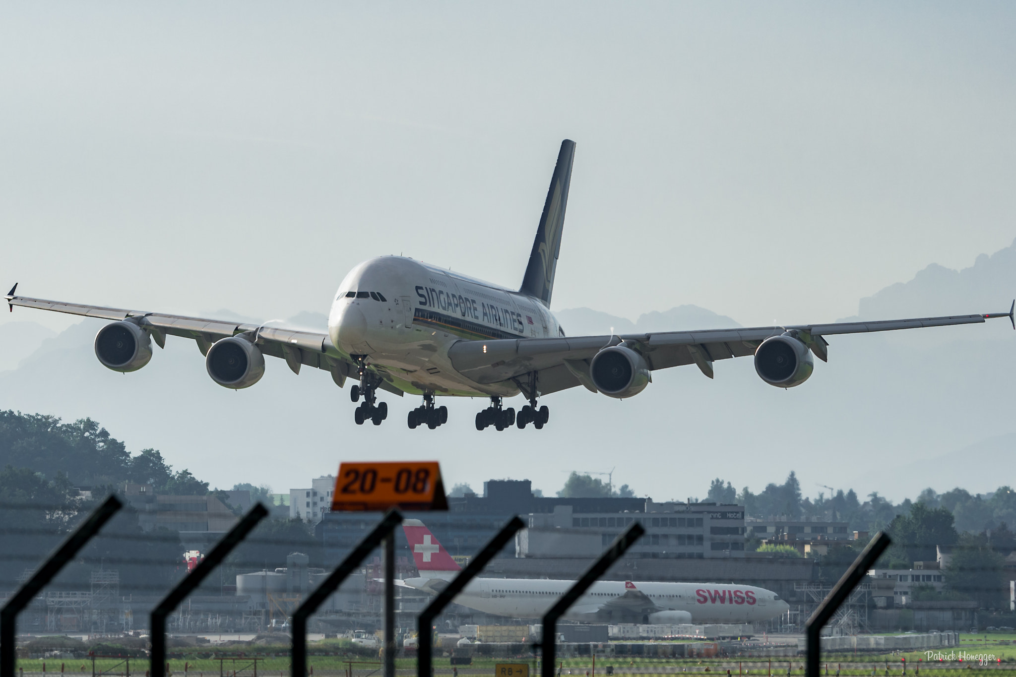 Olympus OM-D E-M10 + Olympus M.Zuiko Digital ED 40-150mm F2.8 Pro sample photo. Big fish (a380) landing at zurich airport photography