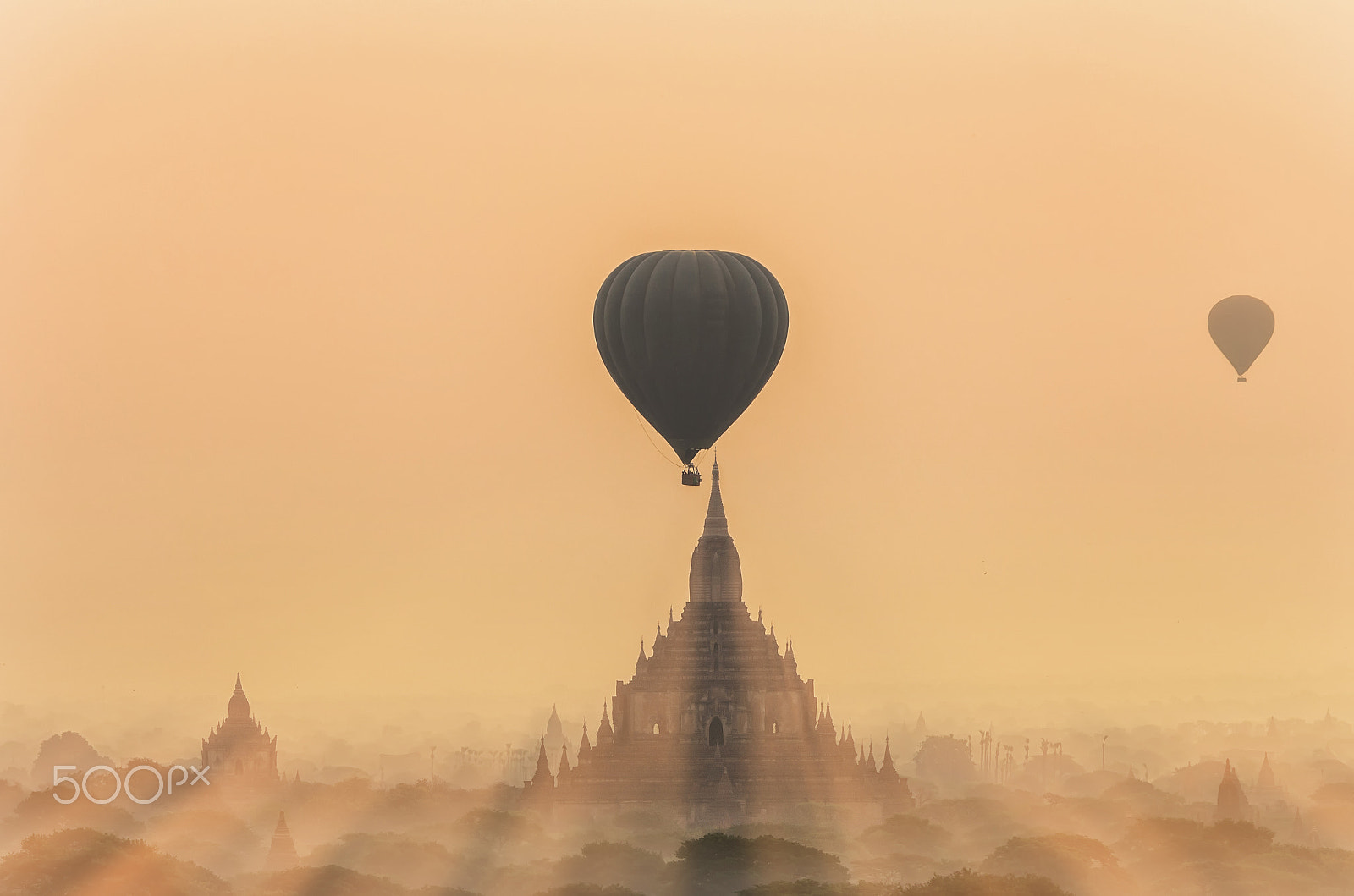 Pentax K-5 IIs sample photo. Ancient temples in bagan with hot air and sun light on the sky a photography