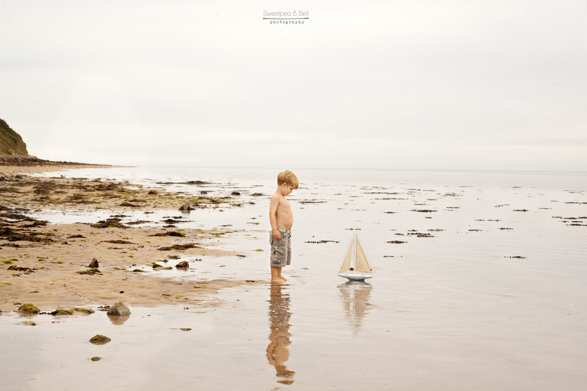 Canon EOS 5D Mark II sample photo. Just a boy his belly and a boat photography